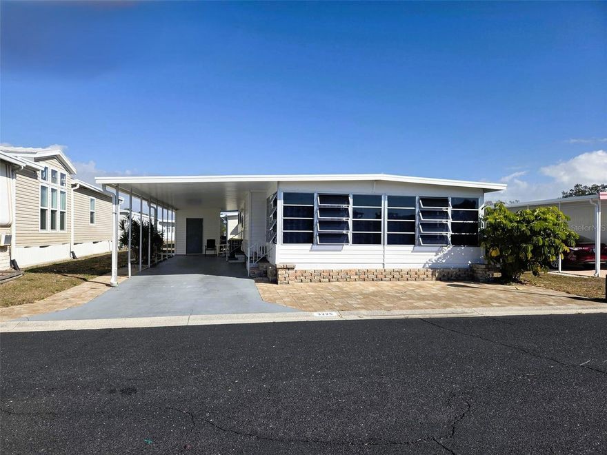 OAKWOOD MANOR — WHERE FUN AND FRIENDSHIP HAPPEN
Escape the cold, Settle into Easy Florida Living

Discover resort-style living in this beautiful 55+ resident-owned community nestled within the city limits of Sarasota. Spanning 90 beautifully maintained acres, Oakwood Manor offers an exceptional and affordable lifestyle for just $210/month.

Community amenities include a welcoming clubhouse with a commercial kitchen and event stage, fitness center, library, heated pool, spacious hot tub, bocce ball and shuffleboard courts, and putt-putt golf. Pickleball enthusiasts will love the Legacy Trail, located just a short bike ride away, featuring brand-new courts.
(Please note: no pets, motorcycles, or RVs permitted.)

Pride of ownership shines throughout this meticulously maintained 2-bedroom, 2-bath home, being sold turnkey—just move in and enjoy. Upon entering, you’re greeted by a spacious, light-filled living room surrounded by windows, the perfect place to enjoy your morning coffee. The large kitchen flows seamlessly into the dining area, ideal for everyday living or entertaining.

The kitchen offers generous cabinet space and comes fully equipped with a stove, dishwasher, microwave, refrigerator, plus a washer and dryer conveniently located inside the home. Both bathrooms have been tastefully updated, and the interior color palette beautifully complements the coastal Florida lifestyle.

This home truly needs nothing—just move in and enjoy! Whether you’re seeking a winter retreat or a full-time Florida residence, this property is ready for you.

Recent Updates Include:

Flooring replaced in 2008

A/C replaced April 2025

Kitchen remodeled in 2005

New windows in 2007

Plumbing from house to street converted to PVC (2000)

New rain gutters and downspouts (2024)

The home is spotless and a must-see, with the added convenience of being just steps from the clubhouse, making it easy to enjoy all the community activities.

Ideally located near downtown Sarasota, Siesta Key Beach, St. Armand's Circle, shopping, Sarasota-Bradenton International Airport, and two hospitals, Oakwood Manor offers both comfort and unbeatable convenience.