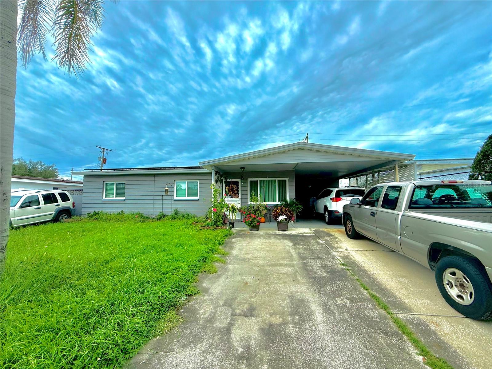 Welcome to this 3-bedroom, 2-bathroom home with a private in-law suite! The main home offers 2 bedrooms, 1 bathroom, PLUS a bonus room. The in-law suite includes a kitchenette, bedroom, bathroom, and private entrance, perfect for multi-generational living. This home has impact-resistant windows and solar panels. Outside, a fully fenced backyard provides plenty of space for entertaining and gardening. Plus, this property was not affected by recent storms or hurricanes. Centrally located, you’ll be just minutes from restaurants, shopping, the airport, Downtown Tampa, Riverwalk, Busch Gardens, and more. Don’t miss your chance - schedule your private showing today!