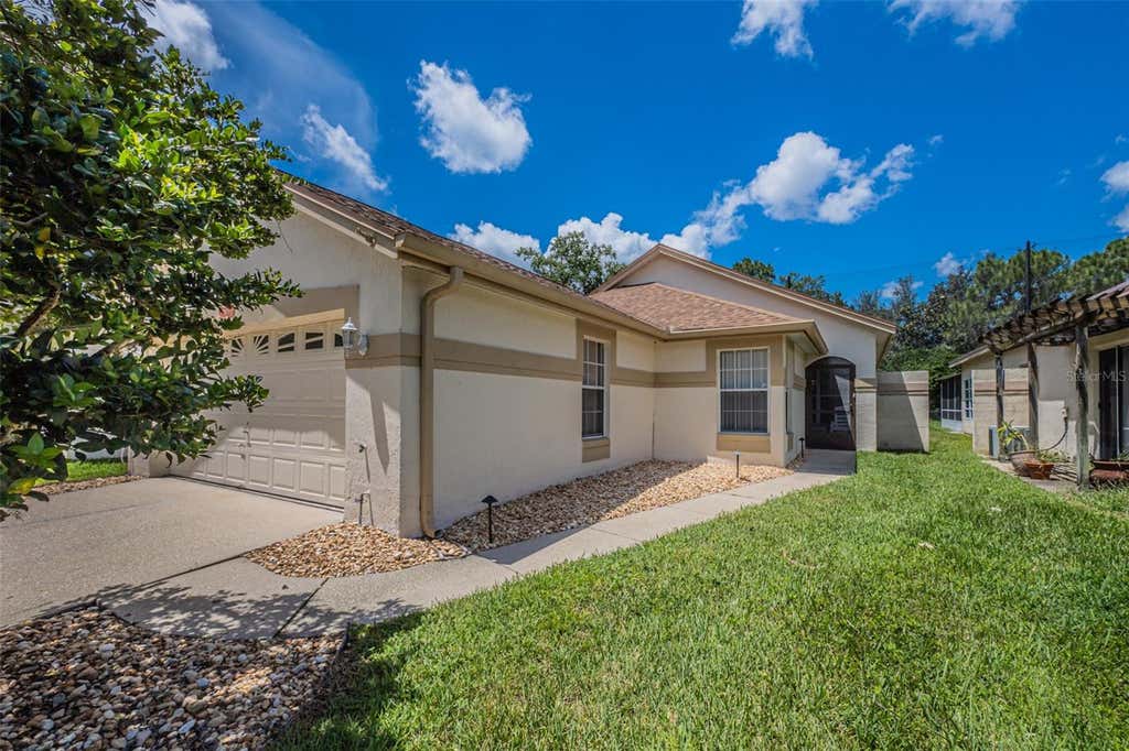 Photo of 11624 Peach Grove Lane, Orlando, FL 32821 (MLS # O6432704)