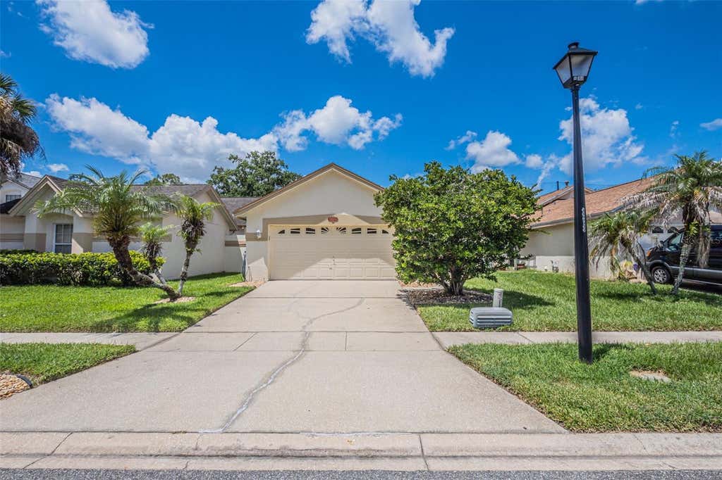 Photo of 11624 Peach Grove Lane, Orlando, FL 32821 (MLS # O6432704)