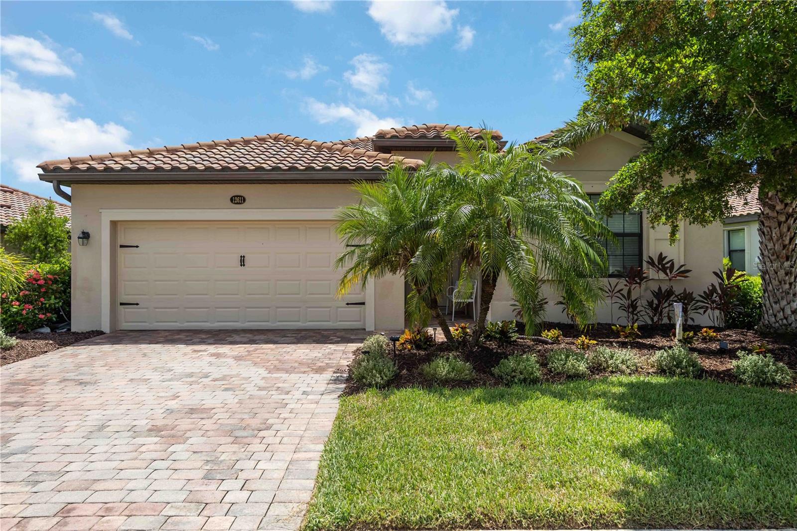 Live like you're on vacation every day! Built in 2016, this 4-bedroom, 3-bath Trevi floor plan offers 2,025 square feet of thoughtfully designed living space, featuring a CUSTOM HEATED SALT WATER POOL/SPA with breathtaking lake and sunset views—all nestled within the resort-style, gated community of Gran Paradiso.
With a practical split floor plan, this home offers a warm and inviting layout ideal for everyday living and entertaining. Three of the bedrooms are located at the front of the home, including a true guest suite with its own private ensuite bath, perfect for visitors or multigenerational living. The other two bedrooms share a nearby full bath off the hall. The spacious primary suite is tucked at the back of the home for added privacy and features pool and lake views, two large walk-in closets, and an ensuite bath with a soaking tub, walk-in shower, and dual vanities.
You'll also find porcelain wood-like plank tile flooring and crown molding in the main living areas. The kitchen is the heart of the home, offering a generous island with bar seating, granite countertops, stainless steel LG appliances, a walk-in pantry, and a whole-house water filtration system—providing clean, high-quality water throughout.
Upgraded outdoor living is a must in Florida, so step outside to your private screened-in lanai with a sparkling CUSTOM HEATED SALT WATER POOL AND SPA, where you can enjoy serene lake views and breathtaking sunsets year-round. Located on a quiet street within a gated community, this home is ideal for full-time residents or seasonal enjoyment.
Gran Paradiso offers world-class amenities designed to elevate your everyday lifestyle. Whether you're enjoying a refreshing swim or a family movie night by the massive resort-style pool and spa, staying active in the state-of-the-art fitness center, playing a game of tennis or pickleball or gathering in the elegant clubhouse, there's something for everyone. The neighborhood is known for its friendly atmosphere, lush landscaping, and scenic sidewalks that wind through the community and around serene lakes—perfect for walking, jogging, or simply taking in the view.
The HOA includes cable TV, lawn maintenance, and access to all community amenities—making luxury living effortless.
All of this is just minutes from vibrant Downtown Wellen Park, where you can enjoy dining, shopping, and weekly events, and less than 10 miles from the pristine Gulf Coast beaches. Schedule your private showing today and discover why Gran Paradiso is one of Venice’s premier lifestyle communities.