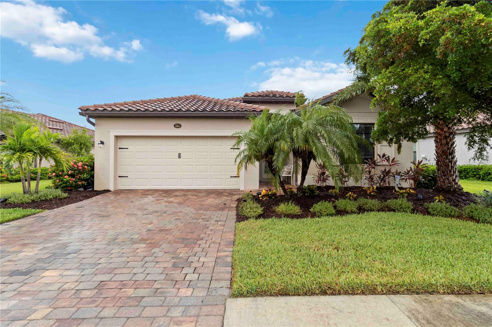Live like you're on vacation every day! Built in 2016, this 4-bedroom, 3-bath Trevi floor plan offers 2,025 square feet of thoughtfully designed living space, featuring a CUSTOM HEATED SALT WATER POOL/SPA with breathtaking lake and sunset views—all nestled within the resort-style, gated community of Gran Paradiso.
With a practical split floor plan, this home offers a warm and inviting layout ideal for everyday living and entertaining. Three of the bedrooms are located at the front of the home, including a true guest suite with its own private ensuite bath, perfect for visitors or multigenerational living. The other two bedrooms share a nearby full bath off the hall. The spacious primary suite is tucked at the back of the home for added privacy and features pool and lake views, two large walk-in closets, and an ensuite bath with a soaking tub, walk-in shower, and dual vanities.
You'll also find porcelain wood-like plank tile flooring and crown molding in the main living areas. The kitchen is the heart of the home, offering a generous island with bar seating, granite countertops, stainless steel LG appliances, a walk-in pantry, and a whole-house water filtration system—providing clean, high-quality water throughout.
Upgraded outdoor living is a must in Florida, so step outside to your private screened-in lanai with a sparkling CUSTOM HEATED SALT WATER POOL AND SPA, where you can enjoy serene lake views and breathtaking sunsets year-round. Located on a quiet street within a gated community, this home is ideal for full-time residents or seasonal enjoyment.
Gran Paradiso offers world-class amenities designed to elevate your everyday lifestyle. Whether you're enjoying a refreshing swim or a family movie night by the massive resort-style pool and spa, staying active in the state-of-the-art fitness center, playing a game of tennis or pickleball or gathering in the elegant clubhouse, there's something for everyone. The neighborhood is known for its friendly atmosphere, lush landscaping, and scenic sidewalks that wind through the community and around serene lakes—perfect for walking, jogging, or simply taking in the view.
The HOA includes cable TV, lawn maintenance, and access to all community amenities—making luxury living effortless.
All of this is just minutes from vibrant Downtown Wellen Park, where you can enjoy dining, shopping, and weekly events, and less than 10 miles from the pristine Gulf Coast beaches. Schedule your private showing today and discover why Gran Paradiso is one of Venice’s premier lifestyle communities.