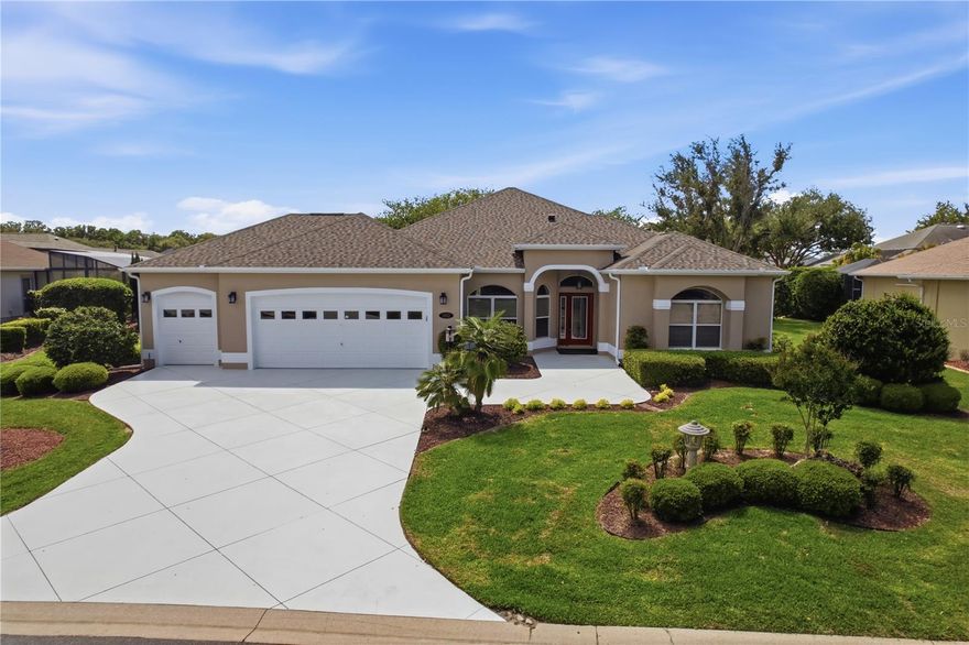 LOVELY CUSTOM & EXPANDED PREMIER HOME located on an Oversized Lot with ENHANCED LANDSCAPING and ROOM FOR A POOL!  Located in BRIDGEPORT AT LAKE MIONA w/2502 sq ft of Living Space!  BOND PAID! GAF SHINGLED ROOF (2023).  Timeless Elegance, Neutral Decor & Impeccably Maintained, this 3/2 PREMIER HOME has an Expanded 2 CAR + GOLF CART GARAGE including pull down attic stairs and a rare 9.5 x10 built-in A/C Storage Room. CUSTOM REDISIGNED Eat-in Kitchen has Rich Cherry Cabinets, GRANITE Counter Tops, an Island enhanced w/GRANITE & Electrical Outlets, Upgraded Appliances including an INDUCTION RANGE, and two closest pantries.  OPEN, BRIGHT & AIRY Living/Dining Room Combo with Volume Ceilings, Cozy Carpet, Built-ins and Sliding Glass Doors leading to a 18x16 ROOF COVERED/SCREENED LANAI. Off the Lanai you will find a 16x10 PATIO perfect for Grilling or enjoying FL Sunshine!  The Substantial Primary Ensuite includes his/her Walk-in Closets, Two Granite Top Vanity Sinks, and a Large Walk-in TILED SHOWER w/ Bench Seat.  The Guest Bedrooms are on the Opposite side of the home offering complete Privacy for your Guests.  The Guest Bath sits between the Guest Bedrooms and has a Tiled Walk-in Shower.  Additional items you will appreciate in this BEAUTIFUL home: Whole House Water Treatment System, Lots of Storage, Great Curb Appeal, NO KISSING LANAIS, PREMIER NEIGHBORHOOD.  The Village of Bridgeport Lake Miona is located on the northern shore of Lake Miona (between 466 & 466A) and is close in proximity to Lake Sumter Landing Market Square and the Palmer Legends Country Club.  Bridgeport neighbors enjoy all the amenities The Villages has to offer - one of which is their very own neighborhood swimming pool and postal boxes.