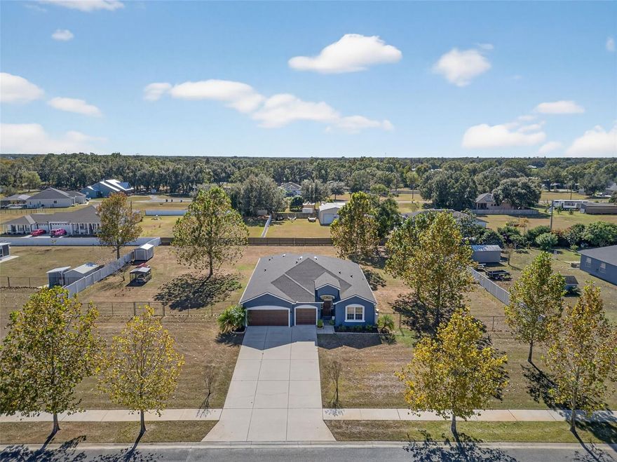 Welcome to this beautifully maintained 4-bedroom, 3-bath home with a 3-car garage, perfectly situated on a full acre in the exclusive 12-home Southern Meadows community. Enjoy the tranquility of country living while staying just minutes from city conveniences; this property combines privacy, space and refined finishes throughout. The well-designed split floor plan features formal living and dining rooms, a dedicated office and a family room equipped with built-in surround sound. The kitchen stands out with extensive granite countertops, upgraded cabinetry with upper and lower crown molding, under-cabinet lighting and stainless steel appliances. The expansive primary suite offers private lanai access, a large walk-in closet and a tray ceiling. Its spa-inspired bath includes a spacious enclosed shower, relaxing garden tub and dual vanities. Secondary bedrooms are thoughtfully located for both comfort and privacy. This home is loaded with upgrades, including:
--New roof (2023) --Exterior paint (Dec 2023) --New attic insulation (Nov 2025) --Garage wired for two- 240V vehicle chargers and a backup generator --Reverse osmosis, water softener and sulfur buster systems --Full security system --Whole-house gutters --All-steel storage shed. The oversized 3-car garage offers exceptional space for vehicles, hobbies, or storage. Outdoors, the massive privacy-fenced yard provides endless opportunities for entertaining, recreation or future enhancements. This rare offering delivers modern comfort, valuable upgrades and peaceful acreage all in one exceptional home.