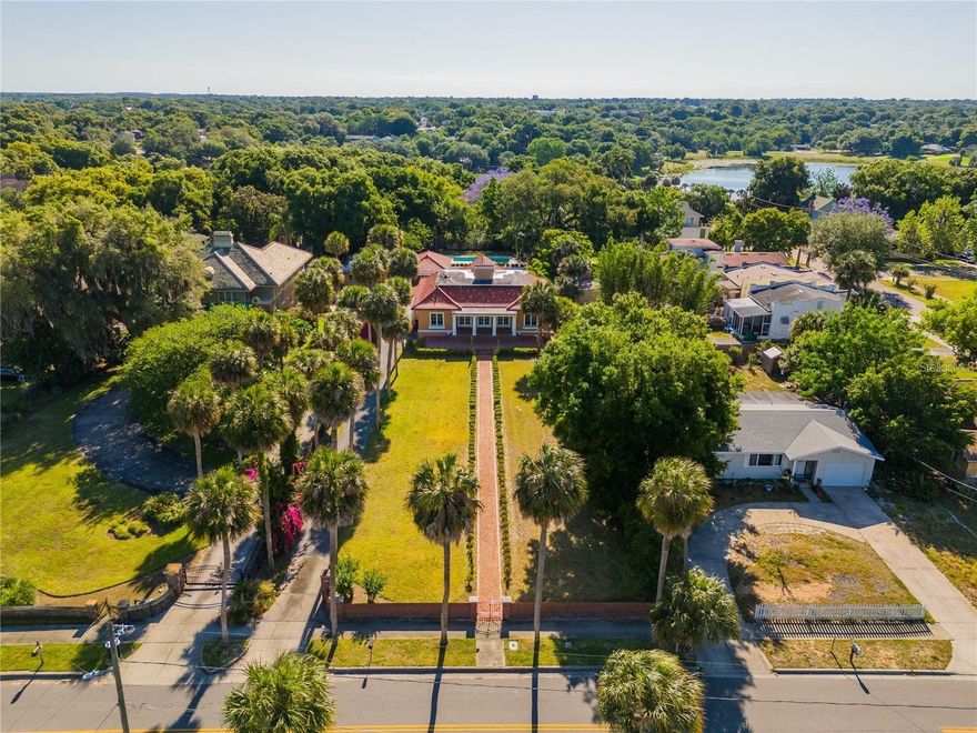 Come see this Historical beauty on Center Street in the heart of Eustis TODAY!!! Located just minutes from all the restaurants and shops in Downtown Eustis. One of the 1st things you notice as you pull up to the house is the BEAUTIFUL landscape of the OVEERSIZED front yard and long driveway. The Roof is Clay Monier tile that has just been done this year. When you walk into the home you can feel the openness because of the high vaulted ceilings that lets in plenty of natural light with the custom architectural skylights. Black Granite floors throughout the living room and family room and in the dining room it has the original hardwood floors. All the windows were duplicated to keep old time feel which were hand done by a craftsman, who also did the floating ceiling in the dining room. The primary bathroom features granite all the way up the walls. The primary walk-in closet is big enough to fit its own washer and dryer. The Basement has been renovated with travertine tile throughout, has a media room, utility room with washer/dryer hook ups, 2bedrooms and its own bathroom. The detached garage has a full bathroom and kitchen. Seller has a set of plans for a cabana. Home features a pool that is fully fenced in. This house has MANY MORE UPGRADES MUST COME AND SEE TO BELIEVE