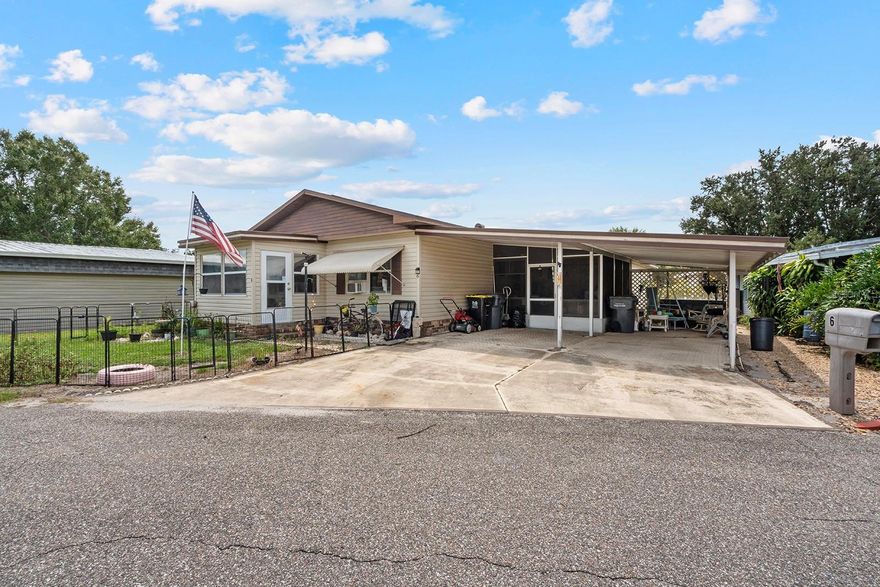 This manufactured home features a 2 bedroom/2 bathroom layout. Built around 1976, this property offers 1,056 sq. ft. The kitchen is equipped with wooden cabinets, a dedicated laundry area for convenience, and vinyl flooring. Both bedrooms include their own bathrooms.


The property includes a triple carport, an attached enclosed 6'×10' glass porch, and utility/storage space. Situated on a lot with large front and back yards, the site is open and not gated.