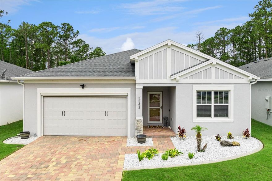 PRICED TO SELL - Westport Reserve in Port Orange! One of the best values in the area, this 2019 move-in ready block home offers 4 bedrooms, 2 baths, and a 2-car garage with a clean, modern feel throughout. Light and bright open-concept layout with new tile flooring in the main living areas and luxury vinyl in the bedrooms. The kitchen features granite countertops, stainless steel appliances, a large island with breakfast bar seating, ample cabinetry, and pendant lighting. Spacious living and dining areas with sliders leading to the covered screened lanai. The primary suite offers a tray ceiling, walk-in closet, and ensuite bath with dual vanities and a custom glass-enclosed walk-in shower, while three additional bedrooms share a guest bath with tub/shower combo. Interior laundry room with garage access. Enjoy outdoor living with the screened lanai and a fully fenced backyard backing to a private preserve with no rear neighbors. Excellent curb appeal with paver driveway, stone accents, and low-maintenance landscaping. Upgrades include Ring security system with floodlight and doorbell camera, backyard floodlight, insulated garage doors, epoxy garage floor, automatic garage screen, glass storm door, Kasa smart switches, Ecobee thermostat, TV mounts, gutters, and landscaped curbing. Community amenities include a pool and walking trails in a convenient Port Orange location close to The Pavilion shopping center, dining, highways, and a quick drive to the beach. Don't miss this standout opportunity-schedule your showing today.