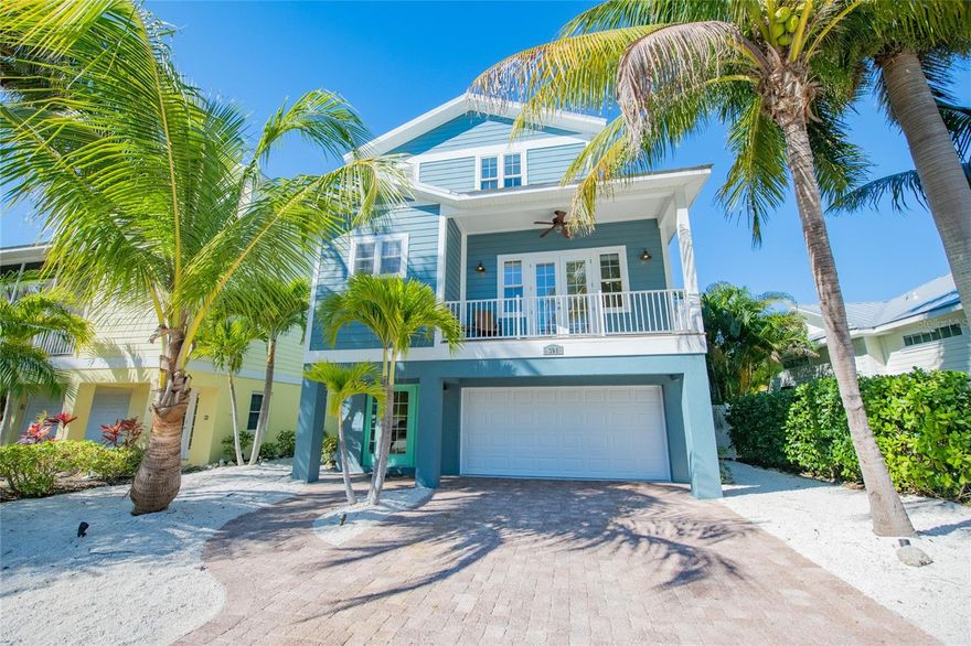 ***Substantial, Price Refresh on this island GEM! *** Welcome to Mojito Splash, the most affordable 5 bedroom with a pool in a rental zone on the whole island! A fantastic beach oasis located in the highly desirable area of central Holmes Beach on Anna Maria Island. This home has recently been updated and is only 2 short blocks away from the beautiful turquoise waters of the Gulf of Mexico. It boasts 5 lovely bedrooms and 3.5 baths. The bright kitchen has granite countertops, solid wood cabinets and is open concept to the dining and living areas. Walk out to the open deck which overlooks the stunning pool. The main living level has a half bath with laundry room. The spacious master king suite has a great private balcony which is the perfect spot for morning coffee. It also features its own en-suite bathroom which includes a large, jetted tub and walk-in shower. Head up to the upper level and find an additional master king suite and en-suite bathroom with a walk-in shower. Plus, 2 additional king bedrooms and a cozy bedroom with a daybed and trundle. These three rooms share a full bath with a shower/tub combo. Next, Relax by the large, heated pool with your favorite beverage after a long day on AMI's gorgeous powder sand beaches. This gorgeous pool has a sundeck entry, dual natural rock waterfalls with seating and a stone-edged spa. It is surrounded by a serene tropical landscape. Get ready to entertain, there is a Tiki bar with solid surface counters, a small under the counter refrigerator and outdoor TV. It also has an indoor game room, a 2-car garage and lots of closet and storage spaces. Walk or bike to shops and nearby dining. Make this your perfect beach getaway or with its successful rental history, a great investment property which sleeps 10. Mojito Splash comes completely coastal turnkey furnished.