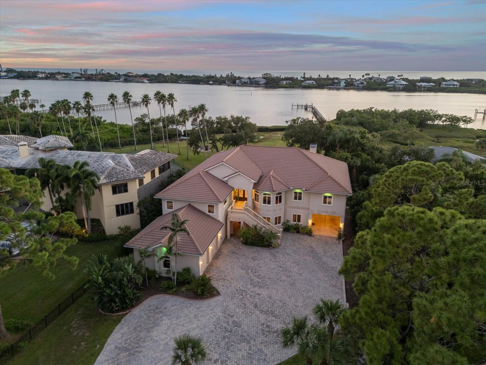 Now Offered at $3,899,777 — Exceptional Value on Lemon Bay
***The private boat ramp and dock have been fully repaired and are now fully operational! Enjoy seamless water access once again — just in time for summer boating season. This restores full waterfront functionality, adding even more value to this unique Bayshore Drive property.***
Presenting 1930 Bayshore Dr, an extraordinary waterfront estate offering 100 feet of direct Lemon Bay frontage and timeless architecture designed to endure. Built with quality that has weathered every Florida storm, this residence stands as a true testament to craftsmanship and resilience.
At $3,899,777, this home represents one of the most compelling values in the area, boasting one of the lowest price-per-square-foot offerings on Lemon Bay—without compromise to quality or design.
Enjoy a private boat ramp, multiple outdoor living spaces with panoramic bay views, and elegant interiors that seamlessly blend comfort with sophistication.
For the discerning buyer seeking privacy, lasting quality, and an unparalleled waterfront lifestyle, this is a rare opportunity ready to welcome you home.
Even during major hurricanes like Helene and Milton, when storm surges reached 10.5 feet, this home remained completely dry and structurally untouched—a rare testament to superior elevation, expert grading, and impact-rated windows and doors throughout.
Inside, the home is a study in coastal sophistication: 5 bedrooms, 3 full baths, 2 half baths, and a gracious, open layout that flows effortlessly between indoor and outdoor living. The primary suite is a refined retreat, complete with a spa-inspired bath, generous walk-in closet, and secondary closet. A guest room upstairs features a private half bath, while others share a beautifully appointed full bath. On the main floor, a guest bedroom is thoughtfully positioned near a full bath, ideal for visiting guests or extended family.
At the heart of the home, the custom chef’s kitchen features premium stainless appliances, bespoke cabinetry, and an oversized island, all opening into the sun-drenched living and dining spaces with uninterrupted views of Lemon Bay.
Outdoor living rivals any resort, with a screened lanai, sparkling pool, and lush tropical landscaping. A private on-site boat ramp is a rare luxury, while the private dock is under contract, with completion expected by June 30, 2025.
Additional features include a 5-car garage, public water and sewer (a rare amenity in the area), and an unbeatable location just minutes to world-class beaches, fine dining, and golf.
This is more than a home—This is a legacy estate, designed to inspire and built to endure. Now offered at an exceptional value, this is a waterfront opportunity not to be missed.