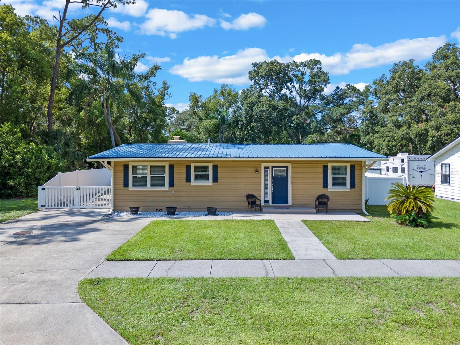 Welcome to 550 Plumosa Drive! This bright + cheerful **3 bed / 2 bath** beauty is located in Sanford's historic San Lanta neighborhood, just a walk, bike ride or golf cart ride away from all the fun in Historic Downtown Sanford! Step inside to a light-filled, open concept layout with modern lighting, neutral paint colors and flooirng throughout. The living room welcomes you with a charming decorative fireplace and flows effortlessly into a spacious kitchen with white cabinets, granite counters and plenty of room to cook and gather. You’ll find three generously sized bedrooms, including a primary suite with walk-in shower, and a large hall bath with a tub/shower combo. There's even a laundry/utility room inside for added convenience.Outside? You’re going to LOVE the HUGE FENCED BACKYARD — perfect for pups, parties, future pool dreams, and anything else you can imagine. Plus, there’s tons of OFF-STREET PARKING, including beyond the fence in the paved side entrance area. This home has already been updated with metal roof (2020), upgraded electrical, plumbing, HVAC (2017) and water heater (2023). This home also includes a transferrable termite bond for added peace of mind. Don’t miss your chance to call this TURN KEY happy home yours!!