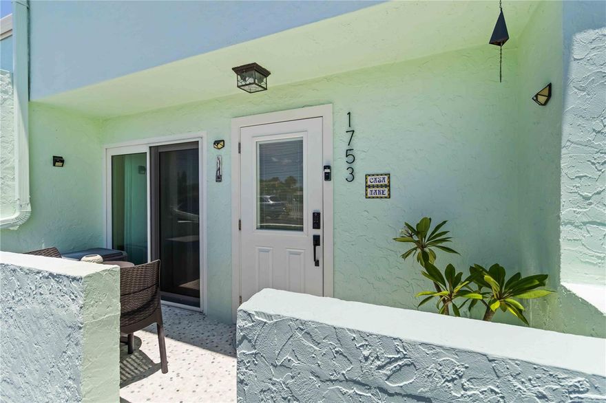 Welcome to Key Point Village, a peaceful, pet-friendly enclave located just over the South Bridge from world-renowned Siesta Key Beach. This rarely available 2-bedroom, 1.5-bath townhome-style condo offers over 1,000 square feet of stylish, updated living space across two levels—perfect for full-time residents or seasonal escapes. Step inside to find an open floorplan with modern finishes, including vinyl and tile flooring throughout. The kitchen is a showstopper with a large center island, sleek countertops, and stainless steel appliances. An adjacent dining space flows seamlessly into the living room, which features an electric fireplace and sliding glass doors leading to the oversized screened lanai—ideal for morning coffee or entertaining guests. Upstairs, you’ll find both spacious bedrooms with built-in closets and access to a full bath. The primary bedroom offers direct access to a screened-in balcony overlooking the pool—perfect for morning coffee or winding down at sunset. A convenient half-bath is located downstairs for guests and everyday use. This unit comes with two assigned parking spaces, and the community offers a heated pool just steps from your lanai surrounded by lush, tropical landscaping. Enjoy peace of mind with hurricane rated windows and doors, and enjoy a carefree lifestyle with HOA fees covering water, sewer, trash, pest control, exterior maintenance, and more. Zoned for highly rated Gulf Gate Elementary, Brookside Middle, and Riverview High, this location also offers easy access to shopping, dining, and downtown Sarasota. Whether you're seeking a low-maintenance beach retreat or your next investment, this move-in ready condo in a prime Sarasota location checks all the boxes.