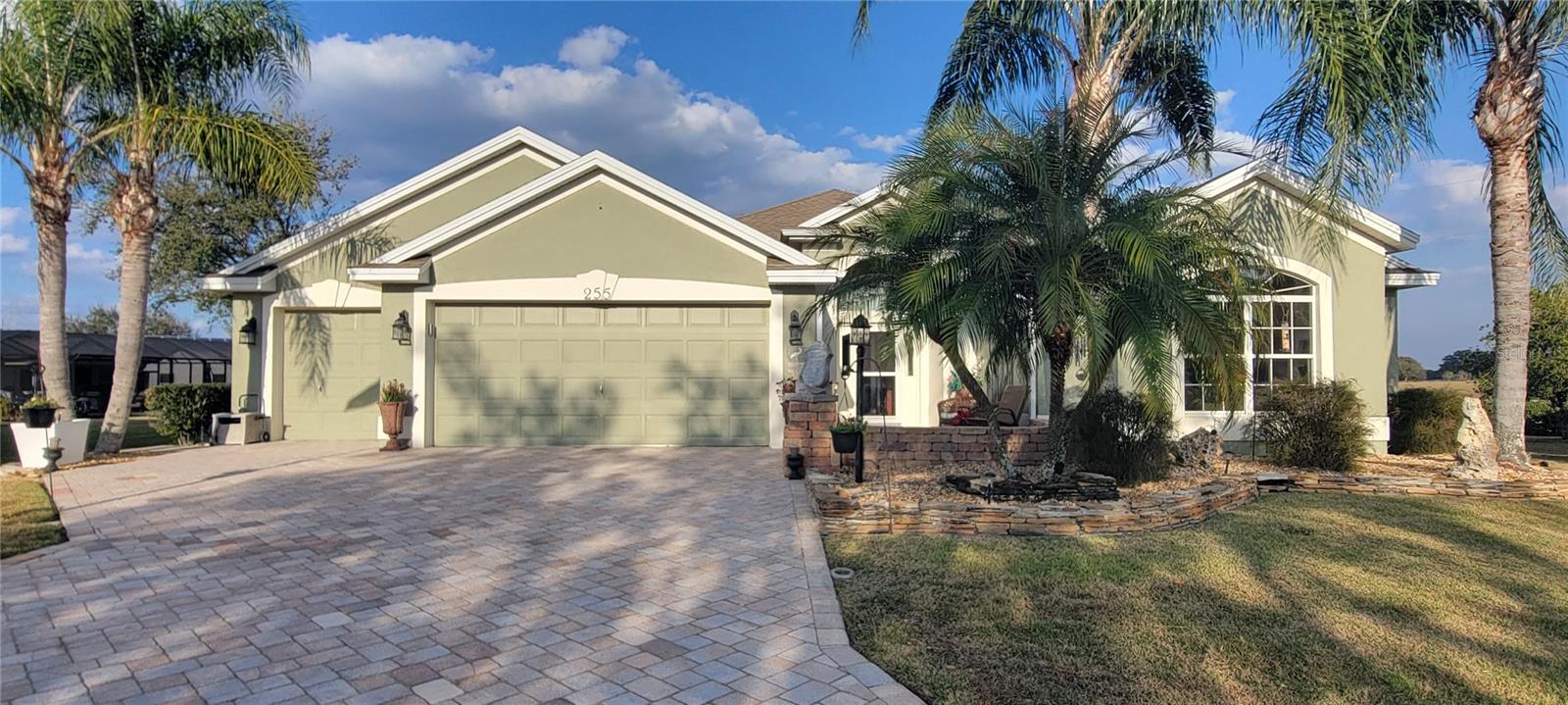 Welcome to this stunning LANTANA with HEATED POOL home, SPA, EXPANDED GARAGE, fits 2 golf carts in golf cart garage of 19.6' long, & NO BACK NEIGHBORS. NO BOND. Situated on a generously sized 0.33-ACRE LOT at the end of a peaceful CUL-DE-SAC, offering unparalleled privacy and a tranquil backyard VIEW OF A FARM. This beautifully maintained property features an array of exceptional upgrades and thoughtful touches that make it the perfect place to call home. Step outside and discover your own private oasis with a heated pool, ranging from 4ft to 6ft deep, equipped with a variable-speed pump for energy efficiency. The stunning OUTDOOR KITCHEN with marine-grade cabinets is perfect for hosting, while the lush, upgraded landscaping with curbing surrounds the entire home. Enjoy the ultimate convenience with a DOUBLE-DEEP GOLF CART GARAGE, insulated attic, and a temperature-controlled attic fan to maintain comfort year-round. Inside, you'll find the home boasts CROWN MOLDING throughout, FOUR Solar Tubes that bathe the space in natural light, and a central vacuum system for easy cleaning. A built-in desk offers a perfect spot for work with a lovely view, and two twin Murphy beds provide flexibility in one guest room. The home is finished with engineered hardwood flooring throughout the living areas and tile in the other rooms, while tinted windows on the south side keep the home cool and comfortable. This home is designed with convenience in mind, featuring TWO WALK-IN CLOSETS in the primary bedroom. and NO "kissing lanai." Additionally, the insulated attic and garage provide added energy efficiency. The property’s prime location in the VILLAGE OF HADLEY offers easy access to everything you need, including the nearby ODELL Recreation Center, 15-20 MIN DRIVE TO 16 golf courses, shopping, dining, medical offices, and entertainment at Sumter Landing and Brownwood squares—all just minutes away. Don’t miss your chance to own this extraordinary home—schedule your private tour today! Previous few items that came up in inspection, have all been addressed. Staging decor items nor furnishings convey with this sale.