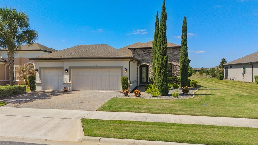 Welcome Home to this Beautiful Farnese model Built In 2019 located in the sought after GATED 55+ Community of The Esplanade at Highland Ranch in the Rolling Hills of Clermont. Featuring 2 bedrooms, 2.5 baths and an office/flex area, this home has both structural and many design upgrades. The OVERSIZED PREMIUM LOT does not have Immediate Rear Neighbors. This home backs to OPEN SPACE. Just off the foyer on your right, you have the office/flex room. The hallway on your left leads you to the spacious 2nd Bedroom offering an En-Suite bath with Tub/Shower, Single Sink with a Comfort Height Vanity and Linen Closet. The hallway to the Garage features the Half Bath with a Mirabelle Key West pedestal sink and your Laundry room with sink and cabinetry for your convenience.  Continuing on to the Family Room, you have the Formal Dining Room for Entertaining while serving your Family and Friends for those special occasions. The Beautiful GOURMET KITCHEN offers 42" Upgraded White Solid Wood Cabinetry with Oversized Crown Molding, Under Cabinet Lighting, Dual Container Trash Bin, Quartz Counters, Glass Tiled Backsplash, Breakfast Bar, 3 Pendant Lights, additional Cabinetry on the Front of the Island, SS Built-In Appliances, and an Exterior Vented Adventium Microwave. The Private Primary Suite offers a Bay Window area that opens up the room and adds Natural Light. The Primary En-Suite offers a Large Walk-In Closet, Double Sink Comfort Height Vanity, Quartz Countertop, Large Walk-In Shower with a Seat, Frameless Glass Shower Enclosure, Beautiful Upgraded Floor, Wall, and Shower Floor Tile. This home also offers the following Inclusions and UPGRADES: 10' CEILINGS, 8' INTERIOR DOORS, TRAY CEILINGS in the Foyer, Family Room, Primary Suite and Dining Room, "B" Exterior Elevation with a STONE FACADE, R-38 Ceiling Insulation, Injection Masonry Foam Insulation, Full 3 CAR GARAGE with Storage Shelves, Tankless Hot Water Heater, Insulated Overhead Garage Door, Full Glass Front Entry Door and Sidelight, Additional Ceiling Lights, Floor Receptacle in the Family Room, Architectural Arches throughout, Ceiling Fans in the Bedrooms, Family Room, Den/Office and in the Extended Covered Outdoor Living Lanai that is Pre-Plumbed for Water, Electric and Gas for your Outdoor Kitchen. Upgraded Ceramic Tile Flooring in the Main Living Area and the list goes on. The HOA fee includes the Lawn and Shrub Care, Fertilizing, Mulching, Irrigation System Maintenance, Gates and Roads. Additionally, the HOA offers RESORT STYLE Community Amenities that include a Pool, Spa, Resistance Pool (all heated), Pro-Style Tennis and Bocce Ball Courts, Pickle Ball Courts (All of the Sports Courts are Lighted for Night Time Play), Fire Pit, Billiards, Table Tennis, Card Room, Movement Studio, Clubs and Activities, Outdoor Kitchen and a Dog Park for our Furry Friends. The Esplanade At Highland Ranch is a sought after community close to Hospitals, Medical Offices, VA, Shopping, Publix, Target, Home Depot, Lowes, Starbucks, Restaurants, Golf Courses, Disney and Other Attractions, National Training Center (NTC), Boating and the Quaint Downtowns of Clermont and Winter Garden. For your traveling convenience, the Esplanade is within a few minutes to the Florida Turnpike with easy access to OIA (30 minutes). The Esplanade at Highland Ranch DOES NOT have a CDD.
