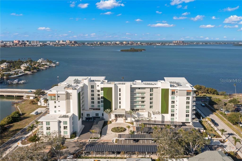 Luxury living in Clearwater FL's newest, most luxurious waterfront condos. Amenities Galore! Heated saltwater pool, outdoor summer kitchens and fire pit lounge, 24/7 concierge, Fiji style bucket shower, 2 jacuzzis, state of the art gym, complete with an infrared sauna, massage room, hair salon suite, clubhouse with poker tables and movie viewing theatre. This beautiful 2-bedroom, 3-bathroom unit, has a versatile den that can easily serve as a third bedroom, nursery or home office. This unit offers sweeping water views from an expansive balcony. The open-concept design seamlessly integrates living, dining, and kitchen spaces, all finished to the highest standards. At the heart of this home is a custom Italian kitchen with a stunning 10-foot waterfall stone island and a Gaggenau gas cooktop. The spa-like bathrooms feature LED no-fog mirrors, floating vanities and chic under-cabinet lighting. Make this your new home today!