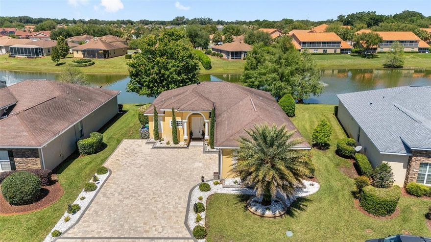 NOW OFFERED WITH A SUBSTANTIAL $50,000+ PRICE REDUCTION — an extraordinary opportunity to secure premier waterfront living at an exceptional value. STUNNING WATERFRONT HOME LOCATED IN A RESORT-STYLE COMMUNITY! This GORGEOUS Ibis model delivers the ultimate Florida lifestyle with a BREATHTAKING WATERFRONT BACKDROP and an outdoor living space that truly steals the show.
 From the moment you arrive, the PAVER DRIVEWAY and ENHANCED LIGHTED LANDSCAPING set the tone for the elegance found throughout this home. Step inside and immediately take in the SERENE WATER VIEWS framed perfectly through the back terrace. The interior is beautifully appointed with CROWN MOLDING, LUXURY VINYL PLANK FLOORS & TILE (No Carpet), TRAY CEILINGS, and an OPEN-CONCEPT layout designed for both comfort and style. The spacious kitchen features a center island, GRANITE COUNTERTOPS, ABUNDANT LIGHTING, and plenty of storage—ideal for everyday living or entertaining. The dining room’s picture window overlooks the patio and pond, creating a peaceful setting for every meal. The primary suite offers a private retreat with a French door leading directly to the Florida room. Two guest bedrooms are thoughtfully positioned on the opposite side of the home, providing comfort and privacy for visitors. The FLORIDA ROOM, WRAPPED IN WINDOWS, showcases PANORAMIC WATER VIEWS and flows seamlessly to the WOW-FACTOR 47'X30' PAVER TERRACE—LIGHTED, and OVERLOOKING water with shimmering fountains. This outdoor space is truly spectacular. Beyond the home itself, the community elevates your lifestyle even further. The HOA includes irrigation, lawn and garden maintenance, and access to a 13,000 sq. ft. clubhouse featuring a fitness center, library, catering kitchen, and event spaces. Enjoy the resort-style pool and spa, putting green, tennis courts, and pickleball courts—all just steps from your door. This is more than a home; it’s a lifestyle. Don’t miss your opportunity to experience this exceptional waterfront property. Water Heater 2025, HVAC 2022, NEW ROOF coming soon.