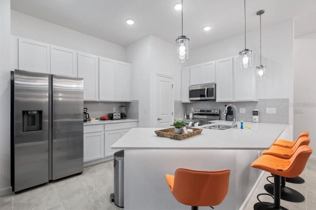 Photo of 10467 Ebb Tide Lane, Orlando, FL 32821 (MLS # O6410971)