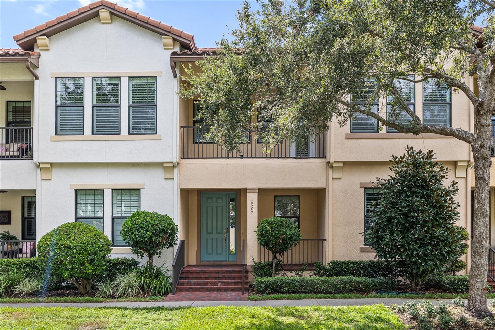One or more photo(s) has been virtually staged. Immaculate 2,000 sq ft townhome in the exclusive, gated Westshore Yacht Club community offering maintenance-free, fee simple ownership. This spacious two-level home includes a direct-access 2-car garage. A charming brick-paved front porch leads into an oversized family room—perfect for entertaining, a home office, or flex space. The first-floor guest bedroom features two large closets and a full hall bath nearby, providing ideal privacy for guests or family. Upstairs, the open-concept living and dining areas showcase 9-ft ceilings, crown molding, decorator lighting, and plantation shutters throughout. Step out onto the east-facing balcony that overlooks a beautifully landscaped park—perfect for morning coffee or evening cocktails. The chef’s kitchen includes a large center island, soft-close cabinetry, granite counters, custom tile backsplash, and brand-new stainless steel appliances. HVAC 2023. Nearby, a spacious laundry room features a brand-new washer and dryer, utility sink, and overhead storage. Also on this level: a pantry closet and powder room. The master suite offers tranquil park views, a cozy window seat, two walk-in closets, and a spa-style en-suite bathroom with dual sinks and a frameless glass shower. Westshore Yacht Club residents enjoy resort-style amenities including a marina, pools, fitness center, spa, tiki-bar with pool side service, and also offers full restaurant on-site dining, 80 Bar and lounge and food delivery straight to your home.
