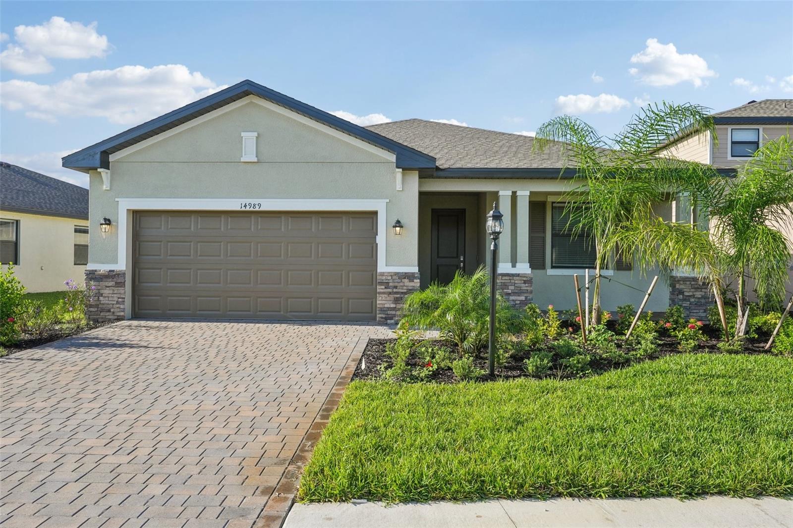 Welcome to 14989 Palamos Cir, a beautifully 2025 appointed home in the desirable master-planned Portico community of Fort Myers. This modern residence combines open-concept living with the comfort and convenience of a thoughtfully designed floor plan looking out to a WATERVIEW.
Step inside to find a bright and inviting great room, perfect for entertaining, with seamless flow into the dining area and a stylish kitchen featuring stainless steel appliances, granite countertops, and a large center island. The split-bedroom layout ensures privacy, with a spacious owner’s suite complete with dual sinks, walk-in shower, and generous closet space.
Enjoy Florida living at its best on your covered lanai, where there’s plenty of room for outdoor dining and relaxing while overlooking your private backyard.
As part of a vibrant master-planned community, Portico offers an incredible lineup of amenities: a resort-style pool, modern fitness center, tennis and pickleball courts, basketball, clubhouse, playground, and scenic walking trails. Here, every day feels like a vacation.
Conveniently located near downtown Fort Myers, I-75, shopping, dining, and the beautiful Gulf beaches, this home is perfect as a full-time residence, vacation retreat, or investment opportunity
WHY WAIT FOR NEW CONSTRUCTION HOME WHEN YOU HAVE THIS COMPLETED NEW BUILT HOME!