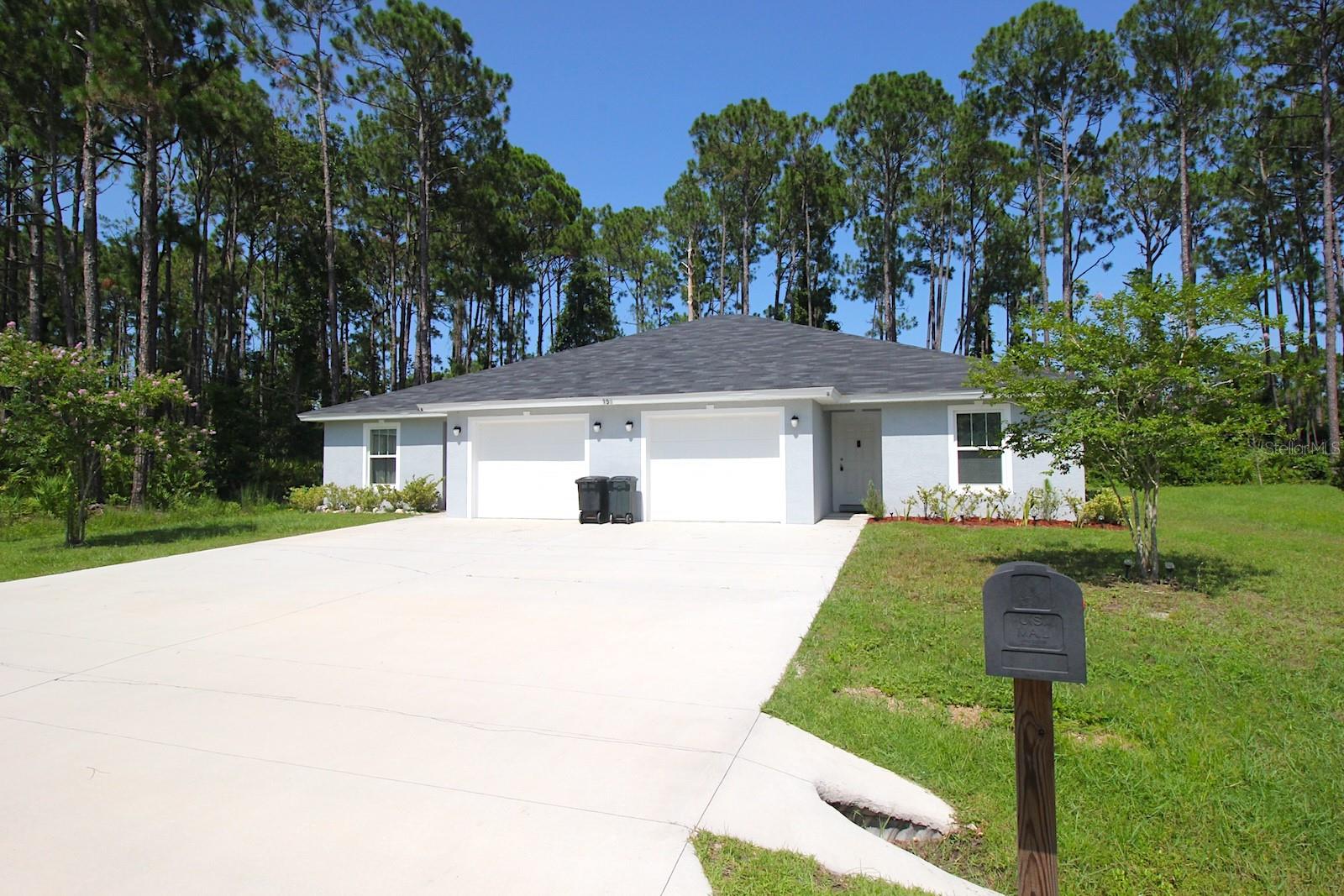 Roomy Duplex Home for sale in Palm Coast! Both Unit A and B feature a 3 Bedroom 2 Bathroom 1 Car Garage open floor plan. Both sides feature LVP flooring throughout the home, energy efficient windows and LED light fixtures. The kitchens features stainless appliances, granite counters and islands, as well as plentiful cabinetry space. Both units primary bedrooms features spacious walk in closets. The bathroom vanities feature matching granite counters. In house utility rooms feature laundry with washer and electric dryer hookup. Both unit A and B also feature 1 car garages, each equipped with door openers. Both kitchens exit to a cozy covered lanai areas, overlooking the back yard which backs up to a wooded area for added privacy. Excellent location situates this house close to shopping along the SR100 including Target, Aldis, and BJs Warehouse, as well as entertainment, restaurants, schools, Advent hospital, and more! Easy access to SR100 and I95 provides for a speedy commute to Daytona or Jacksonville, as well as a quick drive to Flagler Beach! With both units currently rented, this is an excellent investor opportunity. Inquire today!