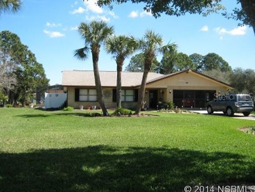 WOW..WOW!!! You won't belive this home.  4 bed 2 bath(also shower outside).  2 car garage with screen doors. In ground screened pool.  Lawn is beautifully manicured. Sprinkler system. Fireplace, skylights and sun tunnels.  Newer garage door that is hurricane strength.  Hurricane shutters, roof 2002, A/C about 1 year old.  Kitchen has 2 pantires. Newer appliances.  Wood flooring in master bed and front bed.