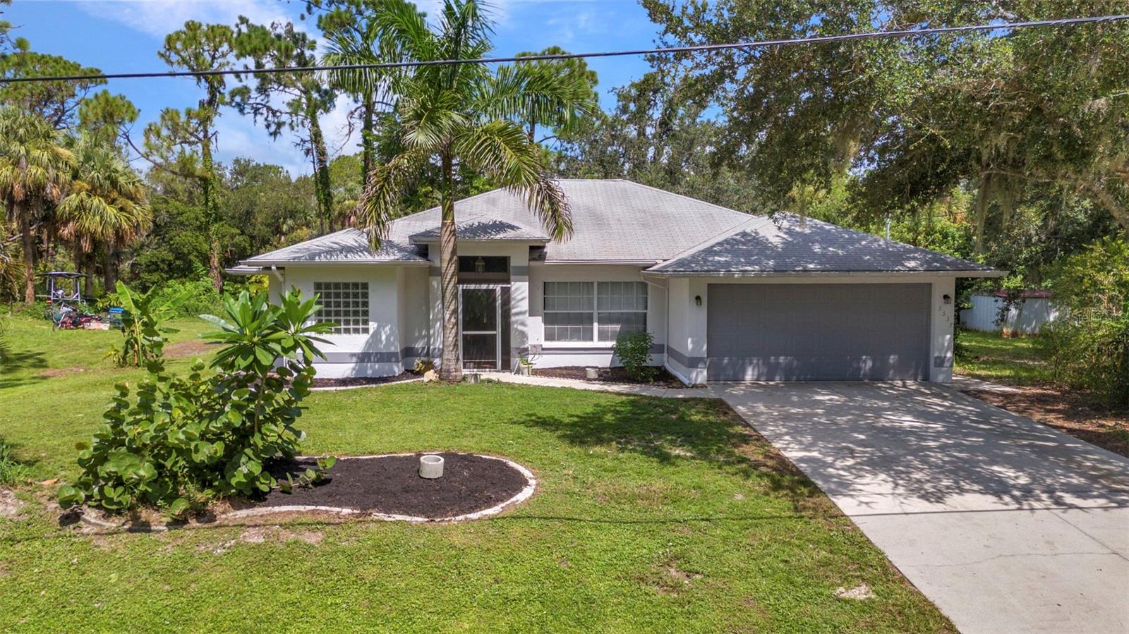 WATERFRONT CANAL HOME ON DOUBLE LOT with AMAZING POSSIBILITES AWAITS NEW OWNERS WITH NO DEED RESTRICTIONS! The sky is the limit to what you can transform this property to be. The adorable 3 bedroom, 2 bathroom, 2 car garage home with a thoughtful layout and large back screened lanai is ideal for any buyer. Additionally, the backyard and additional lot with great canal access for kayaking, boating, fishing, and more mean you can relax and enjoy from your own backyard. Want to build a detached garage, shop, or secondary dwelling? No problem with the adjacent lot as a part of the deal. Nearby to great North Port, FL schools, shopping, restaurants, hospitals, and more, enjoy all this property has to offer in Southwest Florida! Do not delay! BE SURE TO CLICK THE FULL VIRTUAL TOUR LINKS FOR DETAILS!