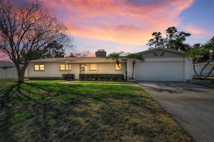 Welcome Home!!  This beautiful 3 bedroom, 2 bath, 2 car garage home is ready and waiting for you!  Set on a quarter acre of beautifully landscaped property with bonus RV/Boat pad on the side of the house including a 50 amp hookup.  So bring your toys!!  Once you walk in you will immediately feel the love and care that has been given to this spectacular home.  Spacious living room with a slate stone wood burning fireplace makes it warm and cozy in the winter time and a large bonus room that can be used as a formal dining room, family room, or even potentially a 4th bedroom.  The 3 bedrooms are generously sized and designed for comfort.  The updated primary bathroom is bright and beautiful.  Whether you're enjoying your coffee on the spacious lanai in the morning or spending time in the huge backyard, this is Florida living at it's finest!  This home is perfectly located near great restaurants, shopping, schools, Eagle Lake Park, and minutes to our beautiful beaches.