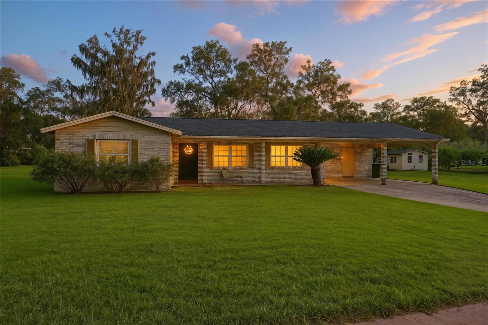 One or more photo(s) has been virtually staged. Welcome to your peaceful retreat! This PET friendly,3-bedroom, 2-bathroom home sits on ONE FULL ACRE of land, offering privacy and space with NO HOA or CDD! Enjoy cooking and entertaining in the oversized kitchen featuring a huge QUARTZ ISLAND, Stainless Steel Appliances, and ample cabinet space. Step outside to relax on the newly screened-in patio—perfect for unwinding with your favorite evening beverage. The expansive yard includes a storage shed and pole barn, ideal for extra storage or hobbies. Include: Washer and Dryer for your convenience. Plus Lawn Care to make life a little easier. Conveniently located near shopping, dining, and entertainment, this home offers the perfect blend of quiet country living with easy access to city conveniences. Don't miss out—schedule your private tour today!