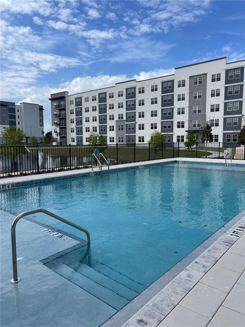 Photo of 5579 Millenia Boulevard #319, Orlando, FL 32839 (MLS # O6400312)