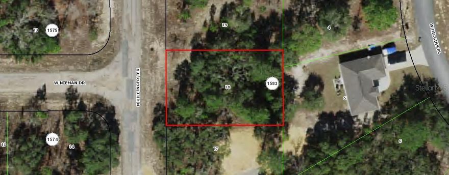 Nearly 1/4-acre land available to build on or use as investment property.  Electric not connected but is nearby.