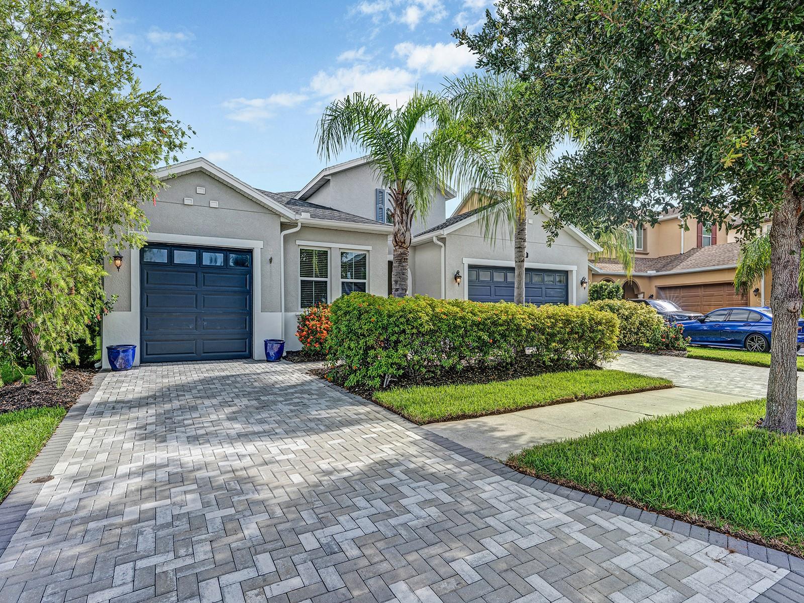 Welcome to luxury water view home in gated Promenade at Lake Park—an exceptional 4-bedroom, 3-bathroom home in Lutz, located in the A-rated Steinbrenner High School. Built in 2017 by Cal/Atlantic Homes, this single-story residence sits on a premium lot with peaceful pond views and wooded sanctuary, approx. 2,645 sq ft heated (3,500+ total), a 3-car garage, and over $250,000 in custom upgrades.
The home features stunning curb appeal with pavered driveway, upgraded exterior lighting, and elegant landscaping. Inside, you’ll find an open floor plan with 10’ ceilings, 8’ doors, crown molding, coffered & tray ceilings, and engineered wood flooring throughout. Enjoy panoramic water views from the great room, with triple glass sliders, Niles 5.1 surround sound, and a built-in subwoofer.
The gourmet kitchen showcases Cambria “Berwyn” quartz counters, oversized island, KitchenAid stainless appliances, 5-burner gas cooktop, extended maple cabinetry with soft-close drawers, Kohler apron-front sink, pendant lighting, and a casual dining space with crystal chandelier and lanai access through the multi-panel stacking glass door.
The luxurious primary suite offers door to the lanai, tray ceiling, ceiling speakers, and a 15’ x 7’ custom walk-in closet. The spa-like en suite includes quartz-topped dual vanities, frameless tiled shower with rain head, garden tub surround, Moen/Kohler fixtures, and built-ins.
Guests will appreciate the private en-suite bedroom, and the A/C-cooled converted garage offers flexible space for a gym, studio, or workshop. The laundry room includes granite counters, upper cabinets, deep utility sink with sprayer, and upgraded Whirlpool washer/dryer.
Step outside to your private retreat: a 1,300 SF screened lanai with a gas-heated spool, 3-tier waterfall, LED lights, and bubblers. Entertain in the custom outdoor kitchen with granite countertops, 304-grade stainless appliances, running water, electricity, and a Yardistry Cedar Gazebo with fan and party lighting. The fenced yard features aluminum fencing with three gates and lush landscaping for privacy.
Additional Features:
• Whole-house Generac 22KW generator,
• Central vacuum, owned water softener,
• Pre-wired for lighting, speakers, and floodlights,
• Insulated garage doors, epoxy flooring, and ceiling storage racks,
• GAF Lifetime Roofing System with transferable warranty,
• Hurricane-impact front windows & shutters,
• Custom cubby/mudroom with built-ins and designer lighting throughout, 4-outdoor security cameras and ring doorbell.
Includes a whole house surge protector for added electric safety during storm.
Enjoy peace of mind in this HOA community with sidewalks and dual gated access. Zoned for top-rated Lutz K-8, Buchanan Middle, and A-rated Steinbrenner High School. This home blends elegant design, smart-home features, and resort-style outdoor living in a prime Lutz location near shopping, dining, and major highways.