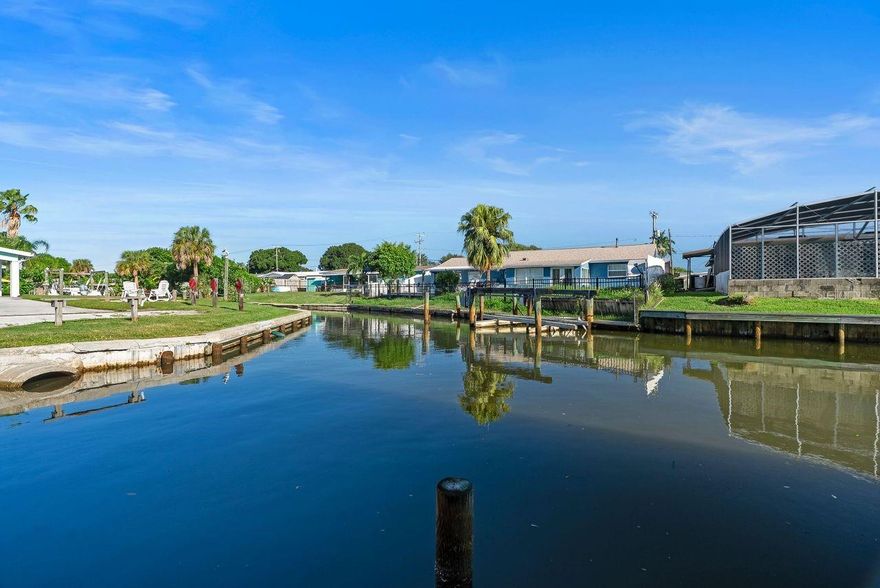 Price Improved! Waterfront living at its finest on Riverside Avenue in Merritt Island. This immaculate concrete block home is perfectly positioned on a deep, navigable canal with direct access to Sykes Creek and the Intracoastal, truly a boater’s paradise. Enjoy spectacular sunrises and sunsets from the oversized covered dock featuring a boat lift, dining area, and ample space to relax and embrace the coastal lifestyle.

Inside, the bright and open floor plan offers two spacious master suites, ideal for multi-generational living, hosting guests, or rental flexibility. The main master features a walk-in closet and direct access to the Florida room, seamlessly blending indoor and outdoor living.

Situated on a fenced corner lot, the home also boasts a large screened patio surrounded by lush tropical landscaping, perfect for entertaining or unwinding after a day on the water. No HOA!

Centrally located with easy access to SR-528, Merritt Square Shopping Mall, Port Canaveral parking, Mitchell Ellington Park, Mila Sports Complex, Space Coast Golf Club, bowling, and the Kennedy Space Center. Just minutes to beaches, shopping, dining, and Port Canaveral. Ideal as a primary residence, winter retreat, or income-producing vacation rental.

A rare opportunity to own waterfront property on Riverside Avenue. Schedule your private showing today!