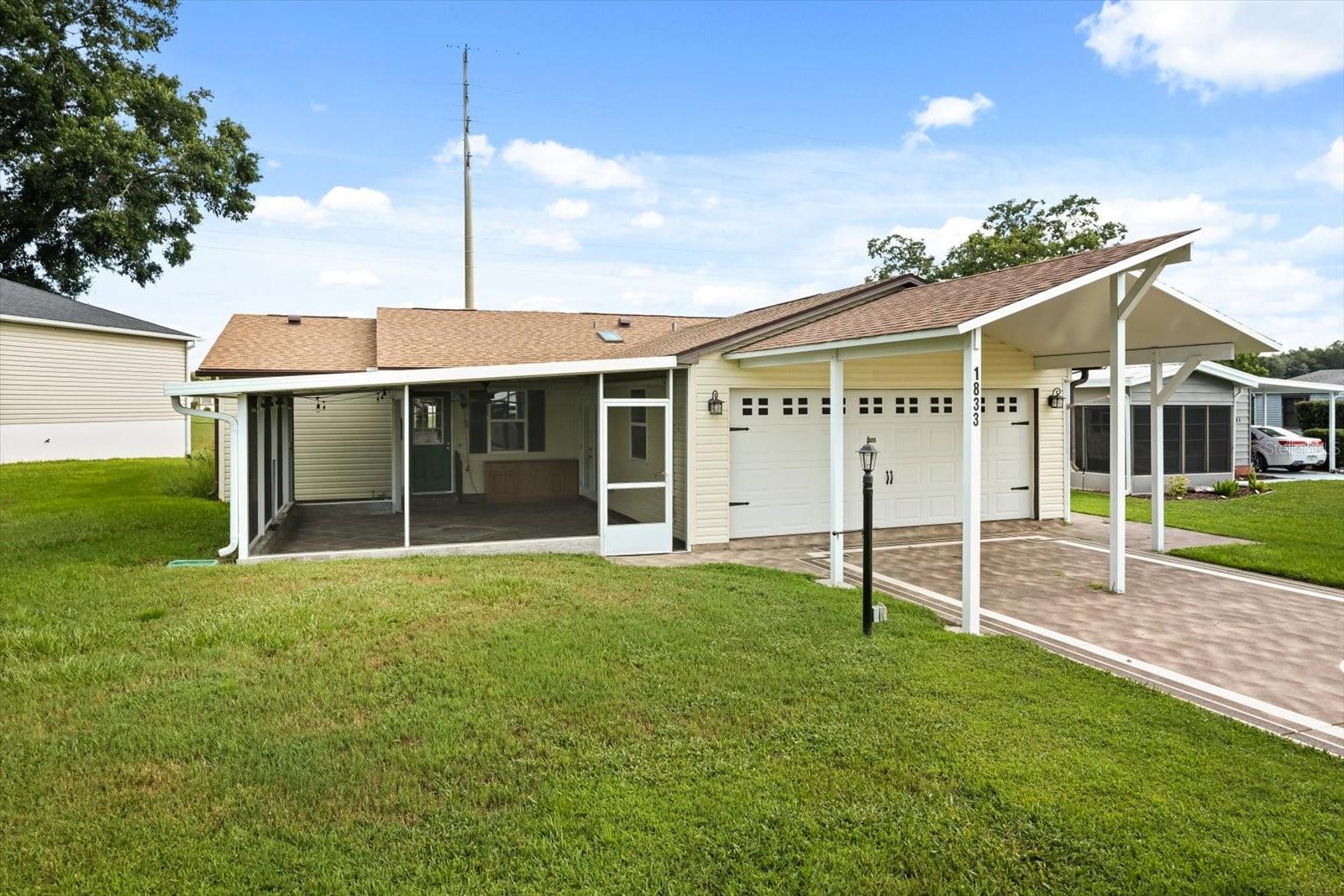 One or more photo(s) has been virtually staged. NO BOND!!! This one-of-a-kind, site-built home in the heart of The Villages offers a rare combination of space, updates, and value, priced lower than any other three-bedroom, three-full-bath home in the community. Enjoy parking for up to six vehicles, including four under cover and two uncovered, plus a side-entry golf cart garage. Relax in two screened lanais – a welcoming front lanai and a rear lanai with a seasonal water view. Inside, you’ll find quartz countertops, stainless steel appliances, wood-look porcelain tile, wood laminate flooring, and new carpet in select areas. The guest bedroom features a Murphy Bed conveniently located next to the guest bathroom, while the main master suite boasts a newly remodeled shower. The second master suite offers its own sitting room and full bath, making it ideal for an in-law suite or private retreat. The spacious living room flows into a great room complete with a 75” TV, projector, and screen for the ultimate home movie experience. Updates include a new roof in September 2024, a new hot water heater in 2022, and a renovation in 2017–2018 with newer A/C, siding, and energy-efficient windows. Located just a three-minute golf cart ride from the Orange Blossom Country Club with its resort-style pool and golf courses, and near the Paradise Recreation Center – currently being rebuilt with exciting amenities including a resort-style pool, expanded Mark Twain Library, fire pit, and shuffleboard courts – this home also puts you just minutes from Spanish Springs Town Square. Enjoy nightly entertainment, dining, and events, as well as some of the very best shopping in all of The Villages, with grocery stores, national retailers, and specialty shops just a short golf cart ride away. This prime location truly combines the best of convenience, lifestyle, and value.