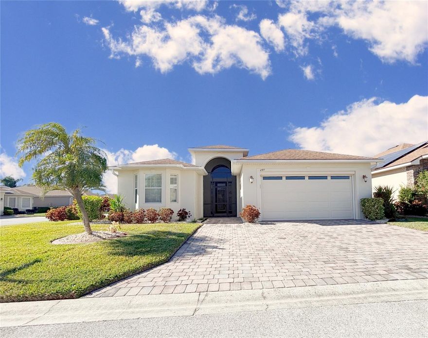 Welcome Home!!! 4577 Back Nine Dr. Winter Haven, Fl. features 3 bedrooms and 2 full baths and is located in Lake Ashton, an Exclusive Florida Retirement 55+ community. This home has BRAND NEW EXTERIOR PAINT!  The widened, paver driveway offers extra room for parking and the screened entry at the front door is an added bonus.  The glass leaded front door with large eye brow window above leads you into a home that is warm, inviting and spacious. The open-concept kitchen showcases granite countertops, stainless steel appliances, Maple cabinets and a Pantry Cabinet with convenient pull-out shelving. You can seamlessly blend indoor and outdoor living by sliding open the living room and dinette area sliding glass doors to the screened, covered lanai with 8" aluminum border base. It's the perfect place for entertaining. The primary bedroom with En-Suite bath has been extended 4 ft. to provide additional living space. It's the perfect getaway and you'll enjoy the EXTRA SPACE in the primary suite. The primary bathroom has ample closet space with His/Her Walk In Closets with Organization System, a large walk in shower with double shower heads, a separate water closet and separate His and Her Vanities. Her vanity has an additional make up area. Guests will appreciate the separate bedrooms and bath behind a pocket door. Additional features include: an automatic screen on the garage door, a separate irrigation meter, 18" diagonal tile in home (Bed 2 and Bed 3 are excluded), crown moulding, New A/C modulator, cabinetry in laundry room, Plantation Shutters in the Bedrooms, Upgraded entry light fixture, surround sound in the living room, additional insulation in the attic,  new interior paint in Bedroom 1 and Guest Bathroom, new interior paint in the formal dining and dinette areas. Lake Ashton, a Florida Retirement community, has a Clubhouse with large grand ballroom, Outdoor Community Heated Pool, Tennis Courts, Bocce Ball, Shuffleboard, Fitness Center, Movie Theater, Bowling Lanes, Restaurant (Charm City)and More! The Health and Fitness center has indoor basketball, indoor racquetball, indoor heated pool, pickle ball and tennis courts, media center, card, craft and billiard rooms. There are two golf courses located in Lake Ashton. Memberships are optional and not a requirement to reside in Lake Ashton. Residents enjoy the resort style amenities and activities offered in Lake Ashton, a premier Florida Retirement Community. Don't miss this opportunity to own your piece of paradise. Check out the photo gallery and make your appointment to tour this home.