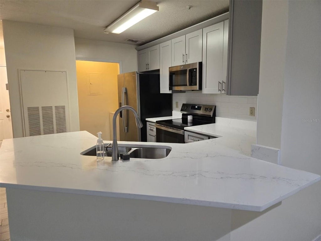 Photo of 7667 N Wickham Road #1202, Melbourne, FL 32940 (MLS # O6452483)