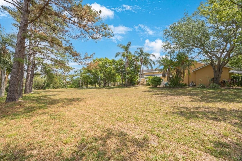 Photo of 24 Sail Harbor Circle Lane, Tarpon Springs, FL 34689 (MLS # A4703528)
