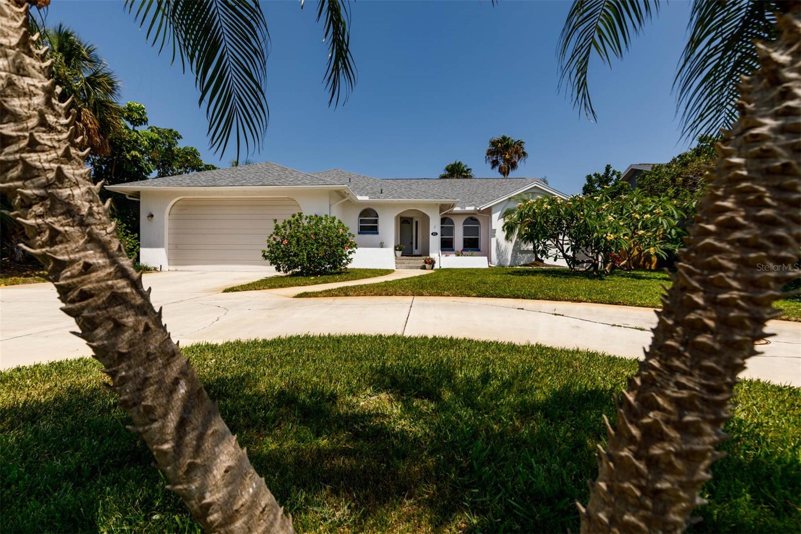 One of the best values on Tierra Verde! Beautifully situated on one of the most coveted and convenient streets in Tierra Verde, this home offers 2 owner's suite options. A split floor plan lends seamless access from almost every room to the enclosed, private, sparkling pool outfitted with an outdoor bar. Newer roof, a/c, pool water heater, refrigerator & pool pump. The kitchen has plenty of cabinet and workspace, a cook’s delight. The family room is open and airy with a soaring fireplace and the built- in cabinets and wet bar make it a room to enjoy. All the bedrooms are light and bright. Gleaming hardwood floors throughout the dining, reading/den/office. A 200+ square-foot bonus room off the oversized garage could be an art studio, workout room or whatever meets your needs. The circular driveway welcomes you in, so come and see all this home has to offer. Move right in and enjoy island living at its best!