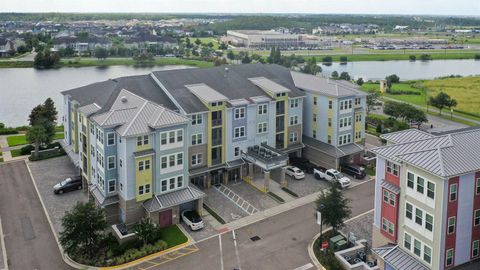 Photo of 7573 Laureate Boulevard #1-307, Orlando, FL 32827 (MLS # O6400250)