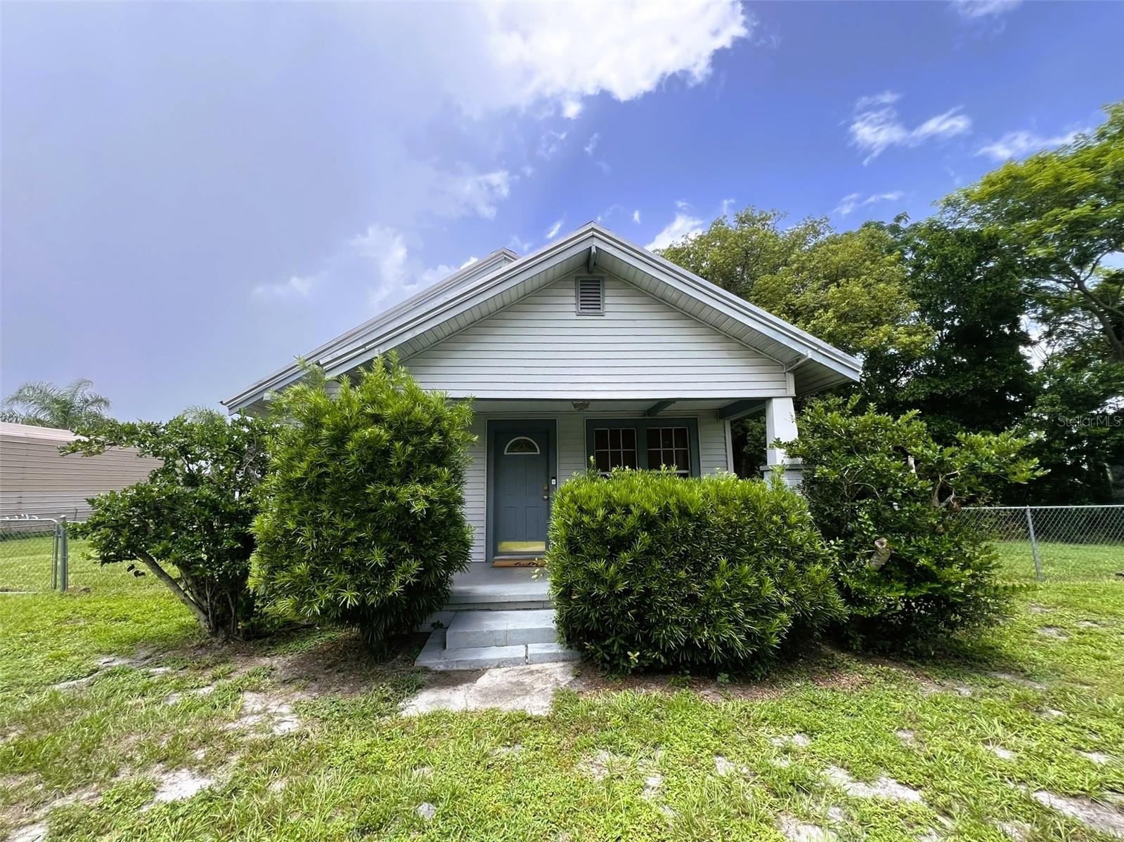 This charming 1924 frame home, nestled on nearly half an acre in West Lake Wales, Florida, offers a blend of historic character and modern convenience.
This cozy 2-bedroom, 1-bath home features a durable metal roof and comfortable central air conditioning, with a new 3-ton AC system installed in 2023. For your peace of mind, the entire home was rewired with new electrical in 2020.
The large room in the back of the home has historically been utilized as the primary bedroom, offering a spacious and private retreat. A separate dining room (with closet) provides a dedicated area for meals. The kitchen comes equipped with a refrigerator, built-in oven, and cooktop. A washer and dryer are also included. The bathroom features a single vanity and a tub/shower combination.
Enjoy the expansive outdoor space, fully secured with a chain-link fence. There's plenty of room to add your own garden, and you can take advantage of the impressive 11x24 shed, perfect for storage or hobbies. This property operates on a private well and septic system, offering independence and lower utility costs.
Situated between the thriving communities of Bartow and Lake Wales, you'll enjoy easy access to the amenities and attractions of both cities, including historic downtowns, local events, and various recreational opportunities. The bordering property in the rear is a peaceful cattle pasture, offering a serene backdrop.
Call your Realtor today to schedule a showing!