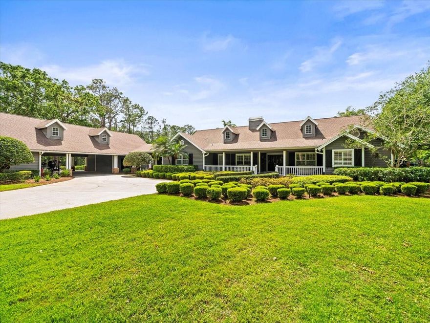 This is an exceptional five-acre gated estate with a relaxing country atmosphere…surrounded by other outstanding private estates. From the gated brick entrance, you will enjoy a long private drive back to a beautiful home with many wonderful features. This home has four spacious bedrooms and 4 bathrooms, providing ample space for family and guests. It also boasts a nice open floor plan, beautiful wood floors and plantation shutters adorning windows that invite in lots of natural light. A large upstairs playroom offers endless possibilities for recreation and relaxation.

As you step outside, you are greeted by expansive landscaping featuring beautiful grandfather oaks and a fish pond. Whether you’re hosting family gatherings or seeking a peaceful retreat, the outdoor amenities are second to none. Enjoy leisurely afternoons by the pool and the advantages offered by the separate building serving as a recreational area, pool bath and outdoor kitchen. For sports enthusiasts, a private tennis court awaits, offering a backdrop of lush greenery and privacy.

Additional features include an air-conditioned man cave/barn, and a practical storage room and RV/boat storage to keep your belongings perfectly organized. Also, in addition to the attached 3 car. garage there is a detached 6 car garage. Equestrian enthusiasts will find much to love, with useable equestrian-friendly acres and the proximity of the Brooker Creek riding trails. Young ones and families can explore and create memories in the three-story tree house, adding a touch of adventure to everyday living. Beyond personal recreation, the spacious pasture area accommodates horses and other livestock. Truly one-of- a-kind property located just minutes from the Tarpon Springs sponge docks, access to the gulf and many restaurants with great views of the Gulf of Mexico. Must see to fully appreciate this unique offering!