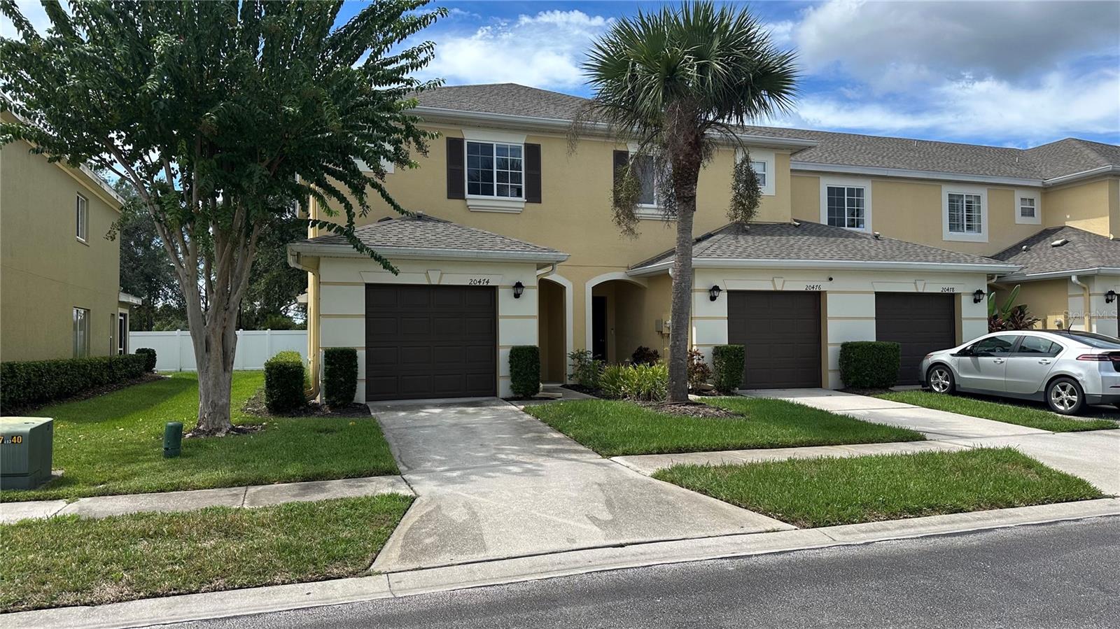 Explore this immaculate townhome that boasts an open-floor plan concept design featuring three bedrooms, two and a half bathrooms, a one-car garage, and situated within a gated community. As you enter, the seamless transition from the foyer to the kitchen and living area is immediately evident. The grand room opens to the outdoors through sliding glass doors, leading to a covered lanai ideal for relaxation, tranquility and outdoor enjoyment. Conveniently located half bathroom is accessible from the living area. The master bedroom is illuminated by a large window and includes two walk-in closets, along with an ensuite bathroom equipped with a walk-in shower and dual vanity. Two other bedrooms on the east side of the 2nd level features are a Jack n Jill a , Jack and Jill bathroom, complete with a double sink vanity and shower-tub combination. Residents benefit from community amenities such as a pool, and a fitness center. This property is conveniently located near major thoroughfares like I-75, a variety of dining options, Wiregrass Mall, Tampa Premium Outlets, several box stores, professional buildings, major hospitals, and the beach.