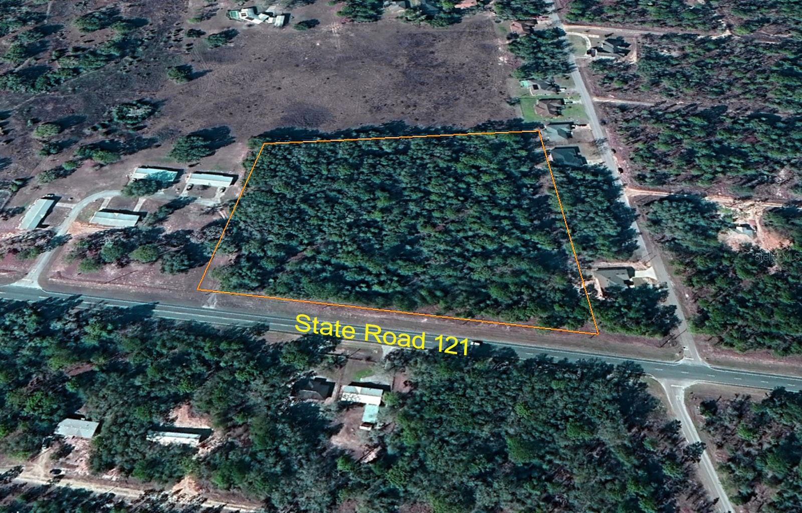 OVER 6.5 ACRES ON STATE ROAD 121! Check out this 6.69 acres with 670' frontage on State Road 121. Located just 5 miles south of Williston this property backs up to the old Golf Course Driving Range. Currently zoned Agricultural/Rural Residential and is adjacent to a Multi-Family apartments. Parcel has many possibilities including single family home or manufactured home. May be able to be re-zoned for multi family units.