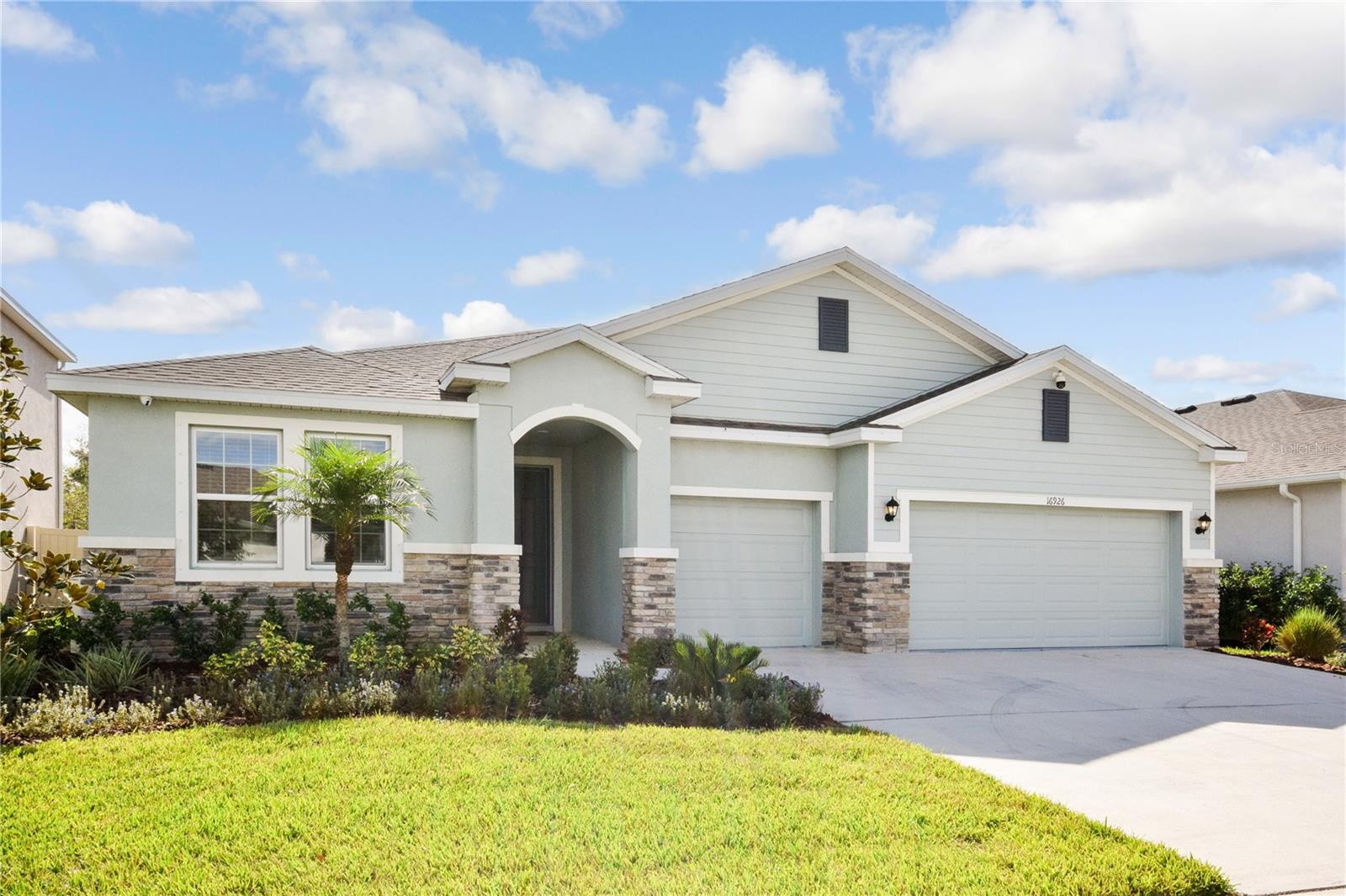 Nestled in the desirable Solera community in Lakewood Ranch, FL, is a stunning Camden model home that embodies the perfect blend of luxury, space, and comfort. Built by D.R. Horton, this all-block residence is thoughtfully designed to cater to modern living while maintaining a warm and inviting atmosphere. As you step inside, you’re welcomed by an expansive layout that includes 4 bedrooms, 3.5 bathrooms, and a 3-car garage, all spread across more than 2,800 square feet of meticulously planned living space.
The heart of this home is the open-concept kitchen, complete with sleek stainless steel appliances, a generous island perfect for meal prep or casual dining, ample cabinetry for storage, and a walk-in pantry to keep everything organized. The kitchen seamlessly flows into the great room and dining area, creating a spacious environment ideal for entertaining friends and family or enjoying quiet evenings at home.
One of the unique highlights of this home is the in-law suite, a private sanctuary with its own entrance, bedroom, living area, and full bathroom. This space is perfect for multi-generational living, hosting guests, or setting up a comfortable home office that offers privacy and flexibility. The primary suite provides a serene retreat with a large walk-in closet and an ensuite bathroom featuring dual vanities and a luxurious walk-in shower. Two additional bedrooms are thoughtfully positioned, sharing a well-appointed bathroom. For added convenience, there’s a half-bath available for guests.
This home also features a whole-home water filtration system, including two reverse osmosis systems, ensuring clean and high-quality water throughout. Security and peace of mind are enhanced with a comprehensive home camera system, including a 360-degree exterior camera, stationary cameras outside and inside, all recorded on a DVR for full coverage.
Positioned just 11 lots away from the community pool and park, the home offers quick and easy access to Solera’s exceptional amenities. The neighborhood is designed with families in mind, offering a resort-style pool, playground, and lush green spaces. Living in Solera also means being close to Lakewood Ranch’s top-rated schools, a variety of dining and shopping options, and recreational activities that make this community truly special.