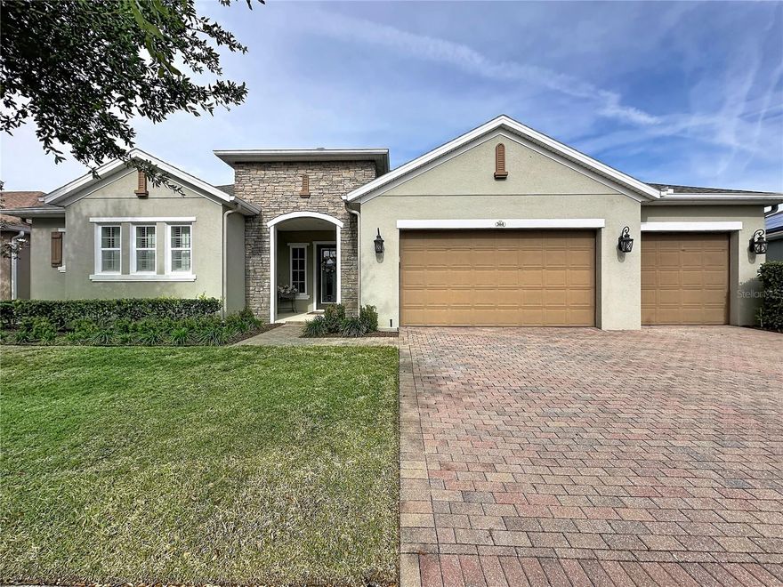 UNIQUE CUSTOM DESIGNED and thoughtfully upgraded Hickory model, located on the highly desirable island, offering approximately 2,551 sq ft with 3 ensuite bedrooms, each with a private bath, plus a separate
powder room. This well-maintained home features an extended screened lanai with ceiling fans, new screens (2022), and pull-down shades for comfortable outdoor living, along with custom closets throughout and a
flexible bonus room with custom glass barn doors. The Gourmet kitchen is enhanced with solid wood 42 inch cabinet and enormous granite island for added convenience, while the primary suite boasts two full-size
custom walk-in closets and a linen closet. Additional highlights include a rare three-car garage with insulated doors and ceiling, Daikin mini-split A/C (2021), and extra blown-in insulation throughout the home. Energy
efficiency and comfort are maximized with a 32-panel TESLA solar system delivering low electric costs, a salt-free whole-house water filtration system, and recent updates including a new roof (2025), A/C servicing and
duct cleaning (2026), and maintained major systems. This home combines space, functionality, and efficiency for exceptional everyday living. Full house surge protection. Community Perks: This guard-gated, resort-style
community offers more than just home, it delivers a lifestyle! The HOA covers cable, high-speed internet, security monitoring, and landscaping/ lawn care so you can focus on enjoying your time. At the heart of it all is the
spectacular 57,000 sq ft Magnolia House, where you’ll enjoy Member-exclusive restaurant and bar with live entertainment. Indoor/outdoor heated pools & a state-of-the-art athletic club Artisan studio, poker room, culinary
kitchen, and creative spaces. Sports courts for tennis, pickleball, bocce, billiards & virtual golf,50+ active, member-led clubs for every hobby and interest. A show-stopping Event Center with a stage and professional AV
setup. This isn’t just a home, it’s a lifestyle upgrade where you’ll find connection, wellness, excitement, and belonging every day. Conveniently located 45 minutes to Theme Parks including Universal and Disney World
and Orlando International Airport, 1 ½ hour to Beaches and Port Canaveral Cruise Terminal. This isn’t just a home — it’s a lifestyle upgrade. Live your BEST LIFE at Trilogy!