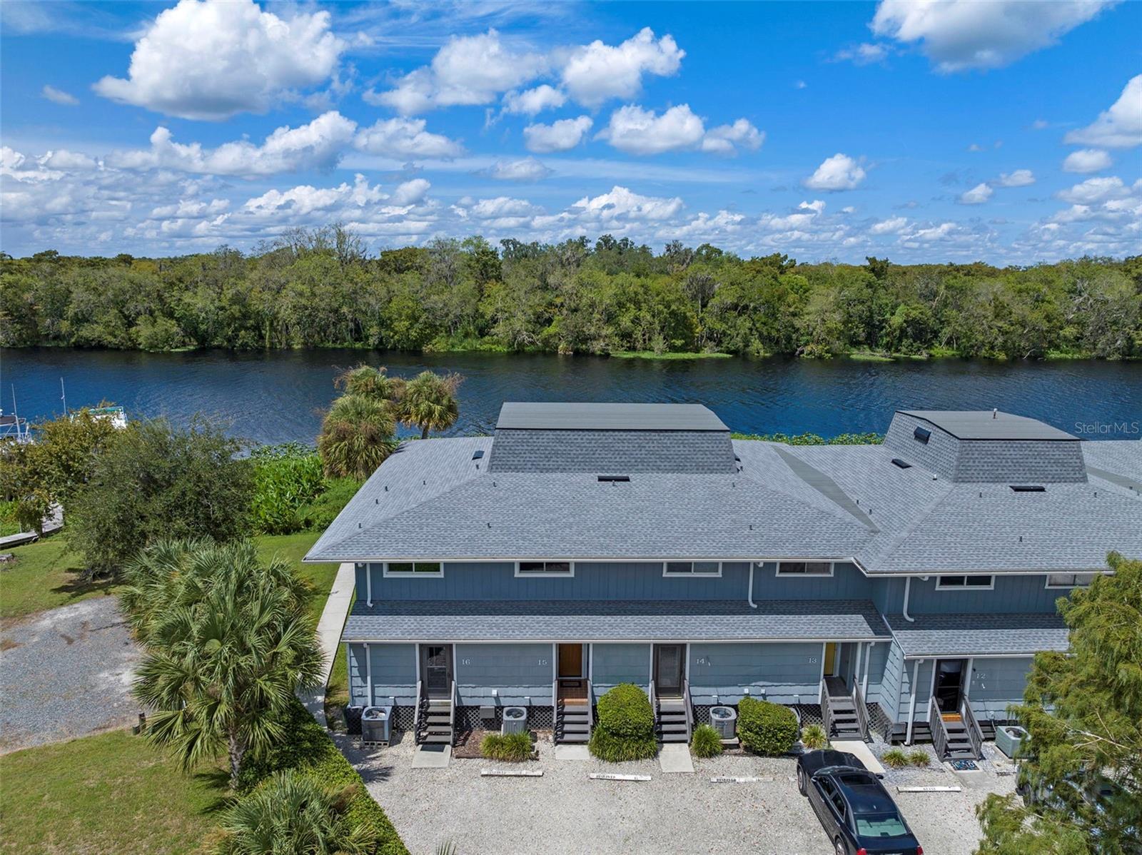 FURNISHED RIVERFRONT CONDO ~ Imagine waking up each morning to the gentle call of the river, where the water mirrors the sunrise and life moves at a calmer, more rewarding pace. This beautifully updated 2-bedroom condo in the welcoming 55+ community of St. Johns River Club offers exactly that—an affordable way to embrace Florida’s waterfront lifestyle. With 1,365 square feet spread across two stories, this home balances comfort and practicality. Step inside and you’ll notice the thoughtful updates and inviting flow. The kitchen shines with granite countertops, stainless steel appliances, and abundant cabinetry—a perfect mix of style and function. The open dining and living areas provide a warm gathering space filled with natural light. Upstairs, both bedrooms feature new Anderson windows for energy efficiency and a fresh, modern touch. Each is a peaceful retreat with large closets and generous storage—something rarely found in condo living. The bathrooms have been tastefully updated, and the convenient half bath downstairs adds to everyday ease. This property comes furnished with essentials and includes peace-of-mind upgrades: a superb water treatment system, a six-year-old HVAC system serviced annually, plus a brand-new roof and gutters replaced in 2024. Life at St. Johns River Club is about more than just a home—it’s about lifestyle and community. With only 16 residences, the neighborhood is known for its friendly atmosphere and well-kept grounds. The condo association covers exterior maintenance, insurance, pest control, and use of community amenities, freeing you to simply enjoy the good life. And the good life here centers on the river. With boat docking available, the St. Johns River truly becomes your backyard. Spend mornings fishing, afternoons kayaking, or evenings cruising under a painted sky. Prefer to stay close? Relax by the pool, or sip coffee on your porch while the river drifts by. Pet lovers will also appreciate that furry companions are welcome (with some restrictions). Beyond the water’s edge, downtown DeLand is just minutes away with its charming shops, dining, and cultural festivals. Daytona’s beaches and Orlando’s attractions are close enough for day trips, yet far enough that your home remains a tranquil escape. Best of all, this condo is priced below market value—an exceptional opportunity for anyone dreaming of riverfront living without stretching the budget. Whether you’re looking for a year-round residence, seasonal retreat, or a place where life feels like vacation, this home is fully updated, beautifully maintained, and move-in ready. This isn’t just a condo. It’s a retreat. A community. A lifestyle. Your riverfront future begins here—at St. Johns River Club.