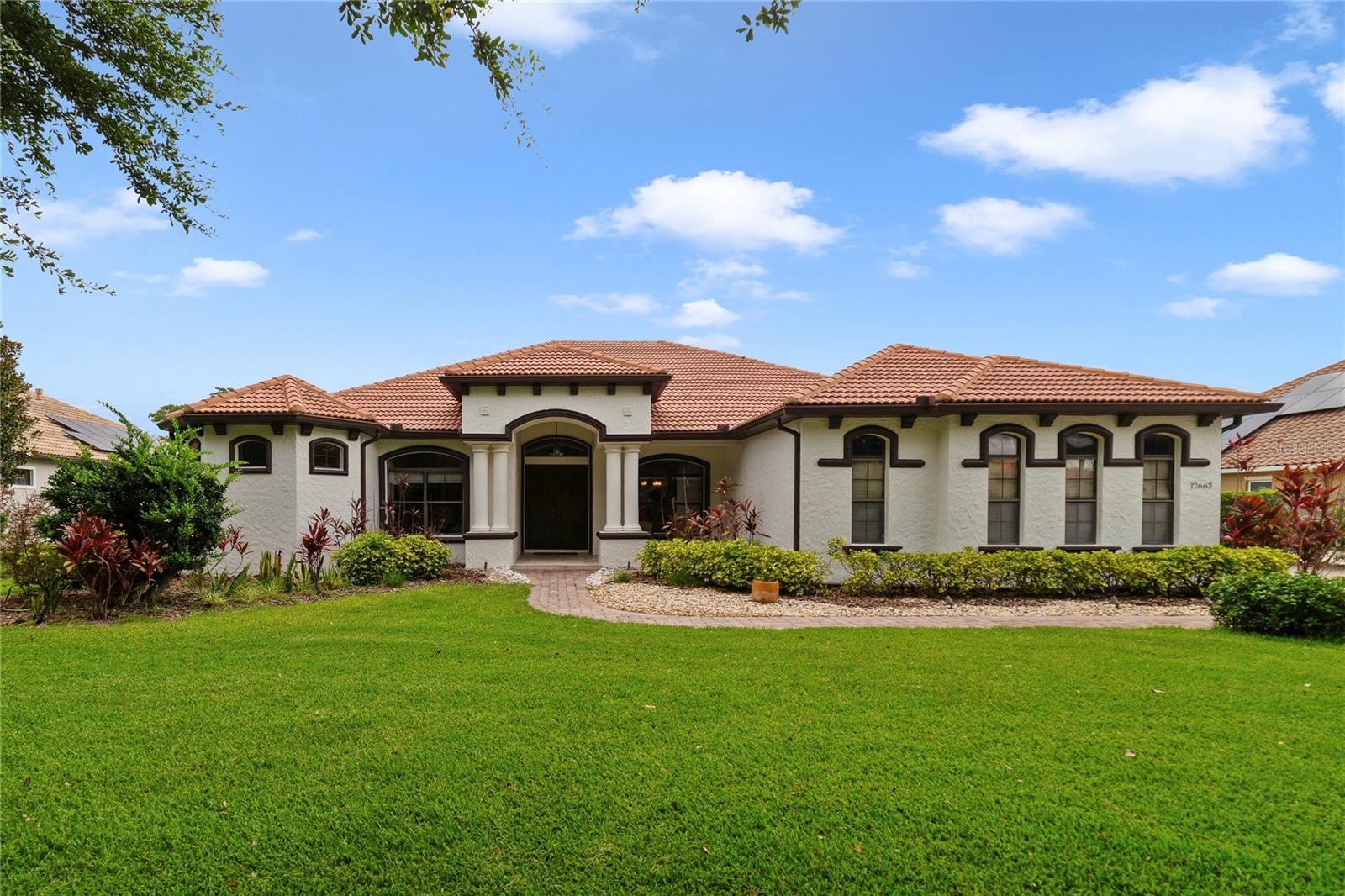 Discover the only single-story lakefront home available under $2 million on the prestigious Lake Sawyer. This rare opportunity offers unmatched privacy, breathtaking views, and true single-level luxury in one of Windermere’s most desirable neighborhoods.
With 5 bedrooms, 3.5 bathrooms, an office, and a 3-car garage, this home blends comfort and sophistication. Inside, you'll find engineered hardwood floors, travertine tile, and elegant crown molding throughout. A 50-gallon in-ground gas tank powers the gas cooktop, water heater, and fireplace, making the home both efficient and inviting.
Recent upgrades include two HVAC units installed in 2021 with transferable labor coverage through 2031 and a 12-year parts warranty, a gas water heater (2017), dishwasher (2021), and an expanded patio with a new retaining wall (2019) — perfect for enhanced outdoor entertaining.
The primary suite is expansive, featuring a private sitting area with panoramic bay windows that showcase the lake. The spa-inspired bath includes a double-entry walk-through shower, whirlpool tub, and dual vanities.
The outdoor living space is a showstopper — with a multi-level deck, covered lanai, and a stunning infinity pool complete with jacuzzi and waterfall, all overlooking Lake Sawyer.
Located in the Lakes of Windermere, residents enjoy access to a fishing pier, playground, park, and community pool, with just a short drive to Downtown Windermere, Disney Springs, shops, restaurants, and major roadways.
This is lakefront living at its finest — and it won’t last long.