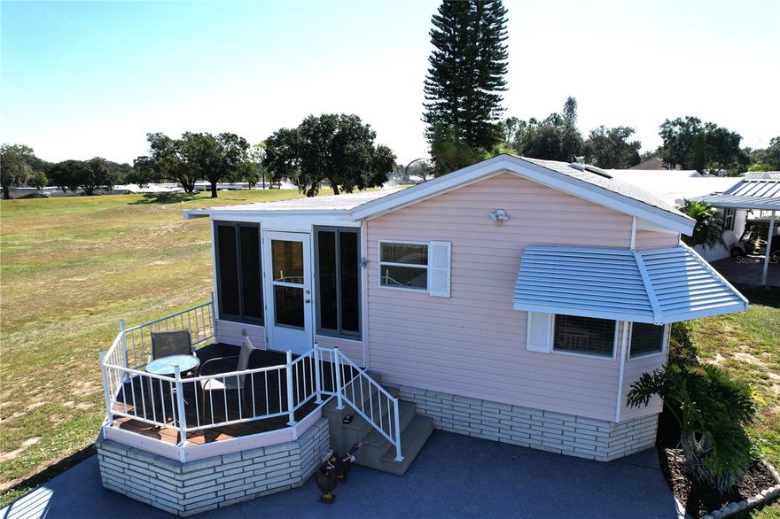 Welcome to DEER CREEK RV GOLF & COUNTRY CLUB!  It’s the perfect time to purchase your new FLORIDA GETAWAY!  Whether you are looking for a sunny place to winter or a full-time residency, this two-bedroom, 1.5 bath model is perfect!  Located at the end of a cul-de-sac on the fairway of the fabulous Deer Creek Golf Course!  This home features an open concept living/kitchen & dining room with a spacious & airy Florida Room that is perfect for entertaining with family & friends! The front porch is perfect for reading a book or visiting with neighbors.  This unique lot has plenty of parking & lots of green space in the highly sought-out Eagles View Community!  An 8 x 12 shed is attached for storing your golf cart garage with plenty of storage for your golf clubs & pool toys!  Great location just minutes from the Eagles View Community Clubhouse, Pool & Shuffleboard Courts!  If you love RESORT style living, this is the place for you! There’s something for everyone!  Deer Creek Community has a MAIN CLUBHOUSE offering a variety of social events throughout the year such as Karaoke, Trivia, Cardio Drumming, Line Dancing, Crafts, Swing Dancing & more!  Soak up the sun at Deer Creek’s MAIN pool, cabana & hot tub area! Try water volleyball, pickleball, tennis, shuffleboard or pool aerobics!  Love golfing? Check out Deer Creek’s 18 Hole Executive Golf Course Leagues & shopping at Pro Shop! The Tiki Bar is a great place to meet new friends with occasional live bands & music! The Greenside Grill is perfect for onsite dining!  Deer Creek is centrally located in Davenport just 20 minutes from Disney & all the attractions that families enjoy! Hop on your golf cart & ride to many restaurants & shops nearby. Bealls, Marshalls, Target & Star Bucks are in Posner Park less than a mile away! Call today to view this HIDDEN GEM in sunny Florida! Just 1.5 hours to each COAST! Looking for a slice of paradise?  Let us show you Deer Creek today!