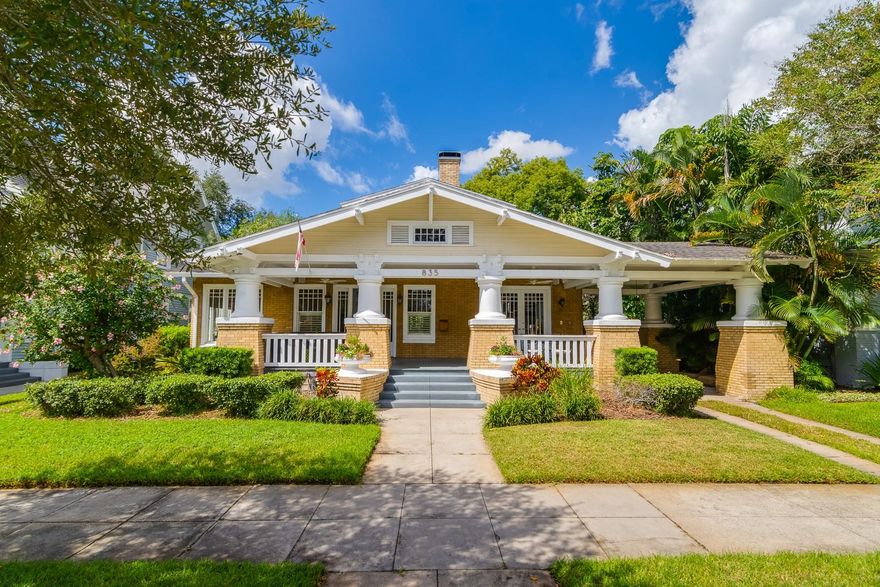 Classic HYDE PARK Bungalow in the sought after “Golden Triangle” featuring gorgeous brick with stately columns, a beautiful porte cochere, glistening pool surrounded by tropical trees, and a desirable guest apartment. The generous covered front porch is a Florida dream, with space to entertain friends and welcomes you into the home. Once inside you’ll find an inviting living room with wood-burning fireplace and wood floors that flow through the home, plus high “coffered-ceilings” that exudes historic charm. Large windows provide ample natural light throughout the home! The formal dining room with fireplace is perfect for special occasions. The open kitchen and family room layout is designed for today’s lifestyle. A built-in bench and breakfast area add to the charm. The gourmet kitchen features a Wolf Gas Range and SubZero fridge, plus a full wet bar complete with ice maker and wine fridge. The DOWNSTAIRS PRIMARY BEDROOM suite is both spacious, with two walk-in closets and brightly lit en-suite bathroom. Four spacious bedrooms fill the second floor of the main home, with a full size laundry room, two full bathrooms and an additional room with built-in shelving that functions as a terrific home office. The backyard retreat features a covered back patio, swimming pool w/spa and picturesque backyard space. The first floor of the garage structure features a pool house for inside entertainment plus a half bath and full apartment on the second floor over garage. Just steps to iconic Bayshore waterfront. Walk 2 blocks to Gorrie Elementary and Wilson Middle School. Walk 6 blocks to vibrant Hyde Park Village filled with exciting shops, top-rated restaurants and a luxury movie theatre. Walk, bike or drive to Downtown Tampa, Water Street and The Riverwalk! Just 15 minutes to Tampa International Airport and 45 minutes to world renowned beaches.