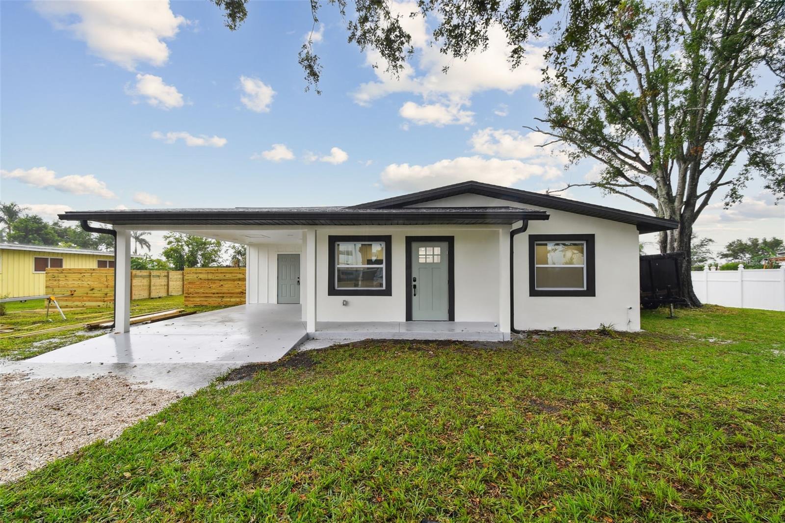 Executive-Level Upgrades at an Entry-Level Price. This fully renovated 3-bedroom, 2-bathroom home delivers the kind of high-end features rarely found at this price point—especially in a market where the median home price is $387,000. Set on a fully fenced 1/3-acre lot, the property is ideally located just 25 minutes from downtown St. Petersburg and Anna Maria Island, and close to shopping, dining, and highly rated schools. The home underwent a full transformation in 2025, including: NEW tri-dimensional shingle roof; NEW soffit and fascia; NEW roof insulation; NEW Carrier 2.5-ton HVAC system; NEW ductwork throughout; NEW electric panel; NEW electrical wiring, outlets, and switches;
NEW plumbing throughout the home; NEW water and sewer lines from house to city connection; NEW tankless water heater; NEW impact-resistant windows; NEW appliances; NEW ceiling fans; NEW high-end porcelain tile in both bathrooms; NEW double sink and dual shower heads in the primary ensuite; NEW waterproof luxury vinyl flooring throughout; NEW fully enclosed fencing; NEW concrete floor in the covered patio.
This is true turnkey living—nothing left to do but move in and make it yours. And with all major systems brand new, insurance on this home is very reasonable, making ownership even more affordable.