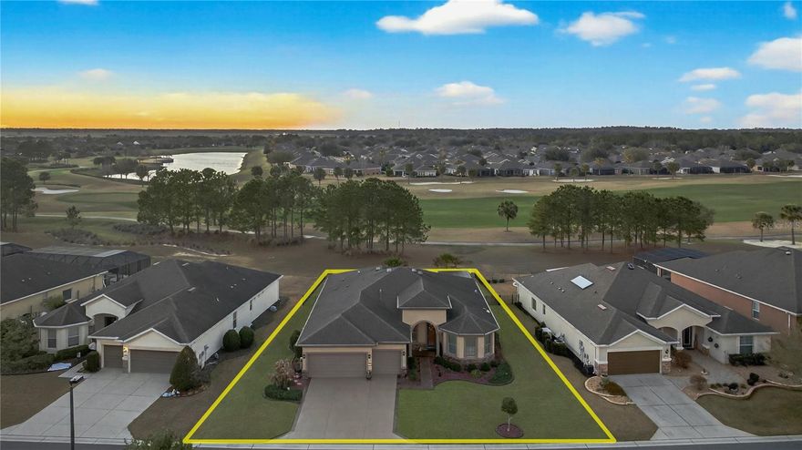 Perfectly positioned on hole #3 with one of the most breathtaking golf course frontage lots in Stone Creek, this Pinnacle model offers nearly 2,600 square feet of thoughtfully designed living space, 3 bedrooms, 3 full baths, a dedicated office, and a rare 3-car garage configuration including a separate golf cart garage with a 2-foot length extension for added space and functionality. From the moment you enter, you'll notice the elevated finishes, wood flooring throughout the main living areas, crown molding through most of the home, rounded corners, surround sound, and a stunning glass wall that draws your eye straight to the sweeping golf views. The living room features a reinforced TV wall mount and flows seamlessly to the screened lanai, also equipped with a reinforced mount and a remote-controlled retractable screen, creating effortless indoor-outdoor living. The kitchen is both elegant and functional, highlighted by a sleek glass cooktop, generous prep space, and an open layout designed for entertaining. Safety and peace of mind were carefully considered with upgraded smoke and carbon monoxide detectors, water leak alert systems under the refrigerator, dishwasher, and washing machine, a Generac whole-home generator, and a brand-new AC system installed in July 2025. The primary suite is a true retreat--generous in size with tray ceilings and large windows overlooking the course. The ensuite bath is beautifully designed with dual vanities, a frameless glass shower, a separate soaking tub, tile flooring, and a huge custom-designed walk-in closet that feels like a private dressing room. Each guest suite offers privacy and comfort. The second bedroom features beautiful bay windows, a spacious walk-in closet, and its own ensuite bath with a stand-up shower and deep vanity. The third bedroom is equally generous with a walk-in closet and an ensuite bath complete with a shower/tub combination. The dedicated office, complete with dual barn doors, provides the perfect flex space for work, hobbies, or a quiet reading retreat. Step outside to your private backyard oasis where the views truly shine. Enjoy the screened lanai, custom hardscape, a remote-controlled fountain, pergola, fully fenced yard, recently replaced St. Augustine hybrid sod, gutters around the entire home, and leaf guard screens along the rear for easy maintenance, all designed to enhance both beauty and practicality. This is more than a home, it's a front-row seat to golf course living in one of Ocala's most sought-after communities. Thoughtfully upgraded, meticulously maintained, and positioned on one of the finest lots in the neighborhood, this Stone Creek showpiece delivers luxury, comfort, and lifestyle in one extraordinary package.