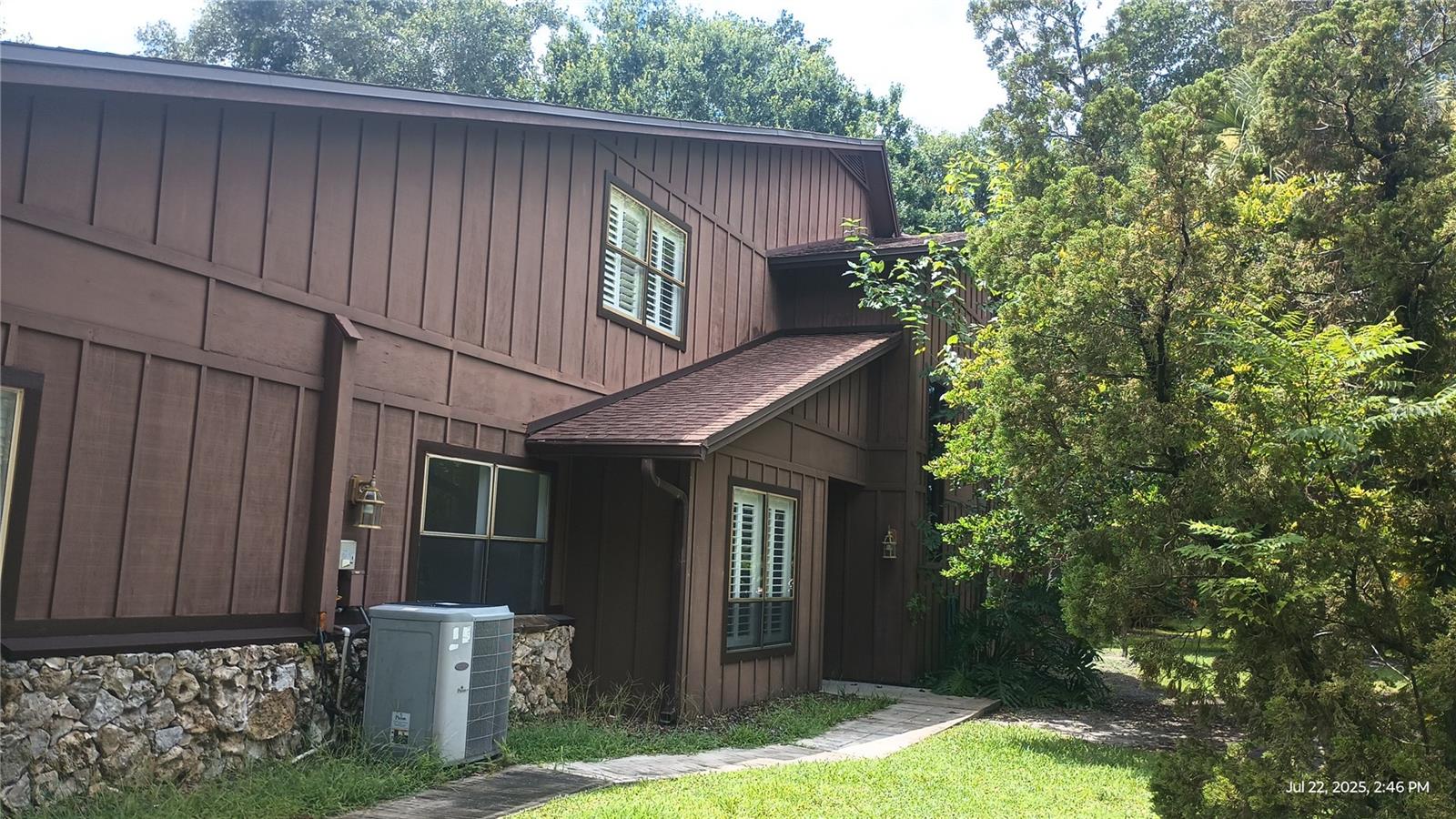 Tranquil wooded community with walking trails throughout. Community pool Short drive to the ocean and I-95. Contemporary 3 bedroom, 2 bathroom townhouse in Oak Village located in The Trails subdivision in Ormond Beach, FL. This corner 2-story home features a convenient 2 car garage with work bench and extra shelving. There's a fenced patio area perfect for enjoying a BBQ or just sit outside and read a book. The primary bedroom is located downstairs. California closet in primary bedroom. Vaulted ceiling in the living room. Separate dining room plus dinette area in the modern kitchen. Stainless appliances, including a dishwasher. Laundry room with washer and dryer. Extra storage under the stairs. Residents can take advantage of the community pool and walking trails throughout the neighborhood. Don't miss out on the opportunity to make this corner townhouse your new home in Ormond Beach. Small dog considered with fee. New laminate flooring downstairs. Community pool is included. Tennis is a separate membership.